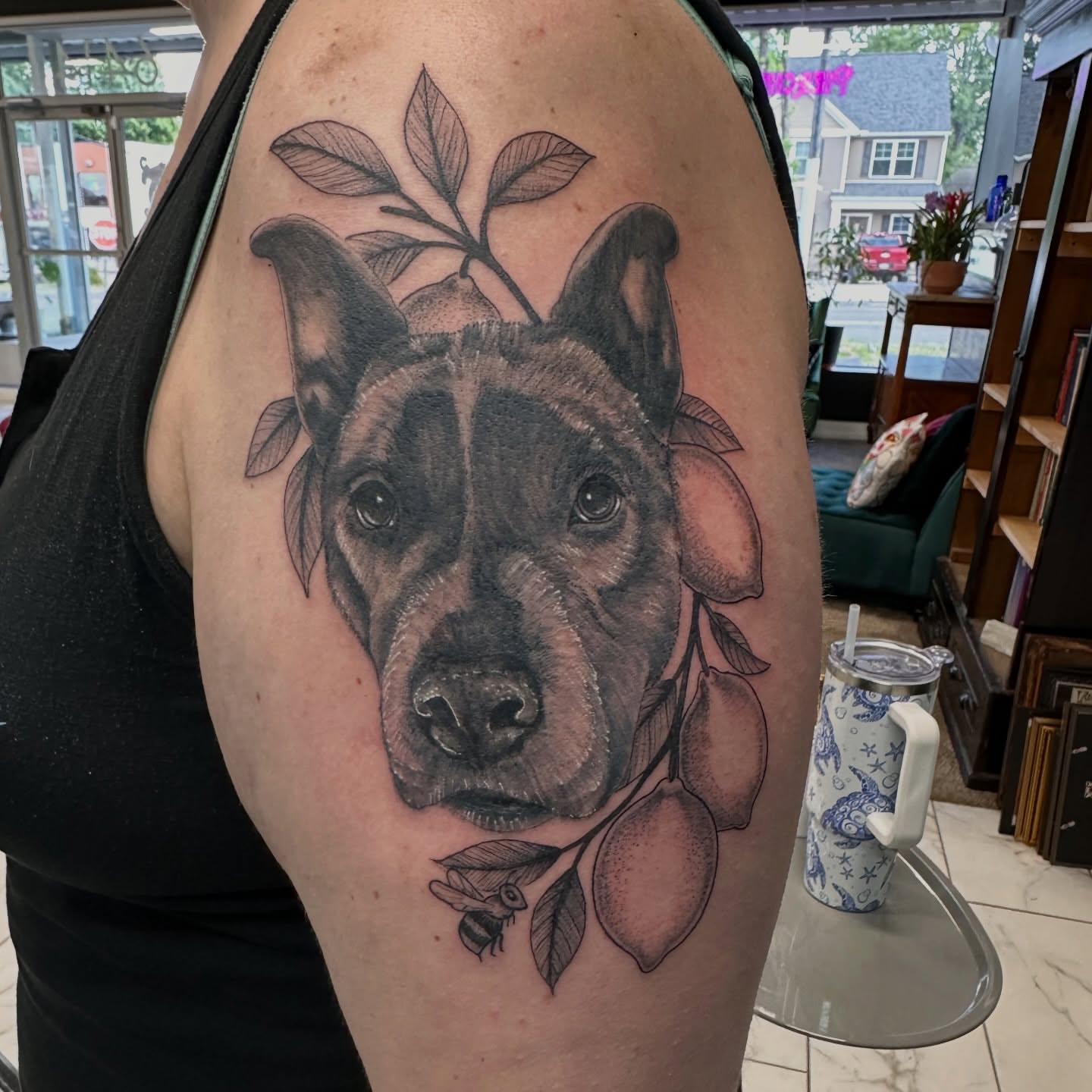 Dog portrait realism tattoo on the shoulder by Chris Gray