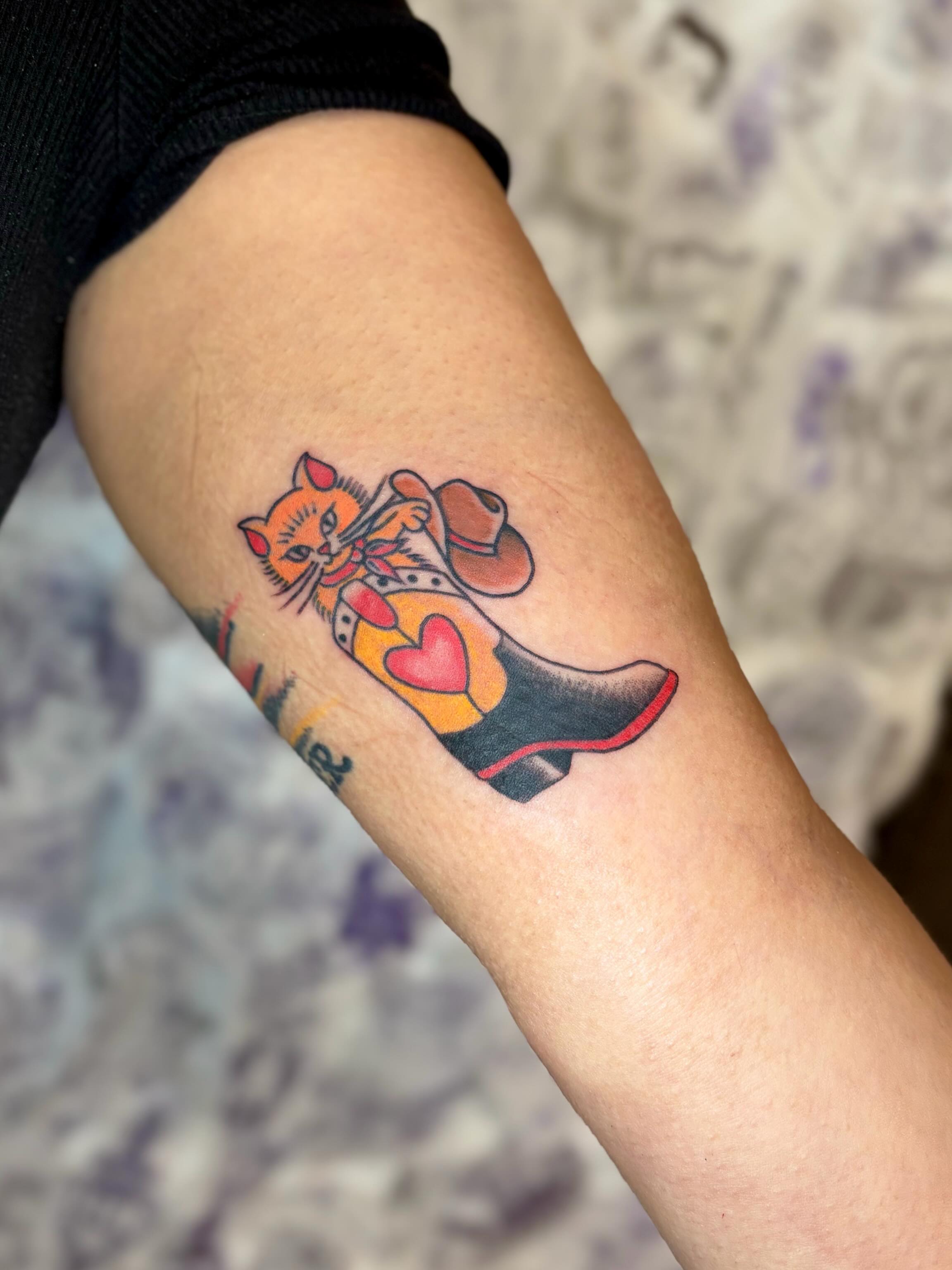 Cat wearing cowboy hat American traditional tattoo on the forearm by Danelle ✶ Nashville Tattooer
