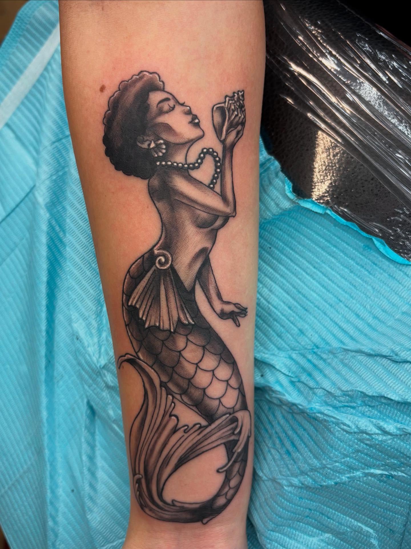 Mermaid realism tattoo on the forearm by Robbie Reel, Wichita, Kansas