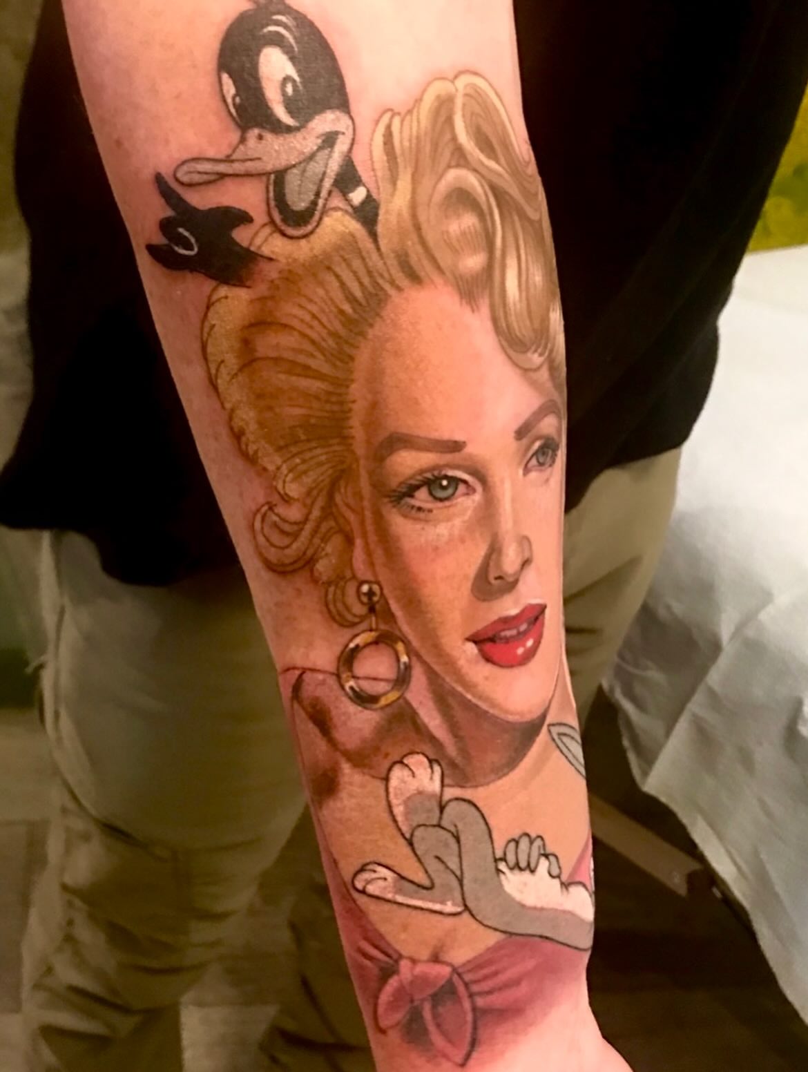 Woman with duck American traditional tattoo on the forearm by Miles Maniaci, Chicago, Illinois
