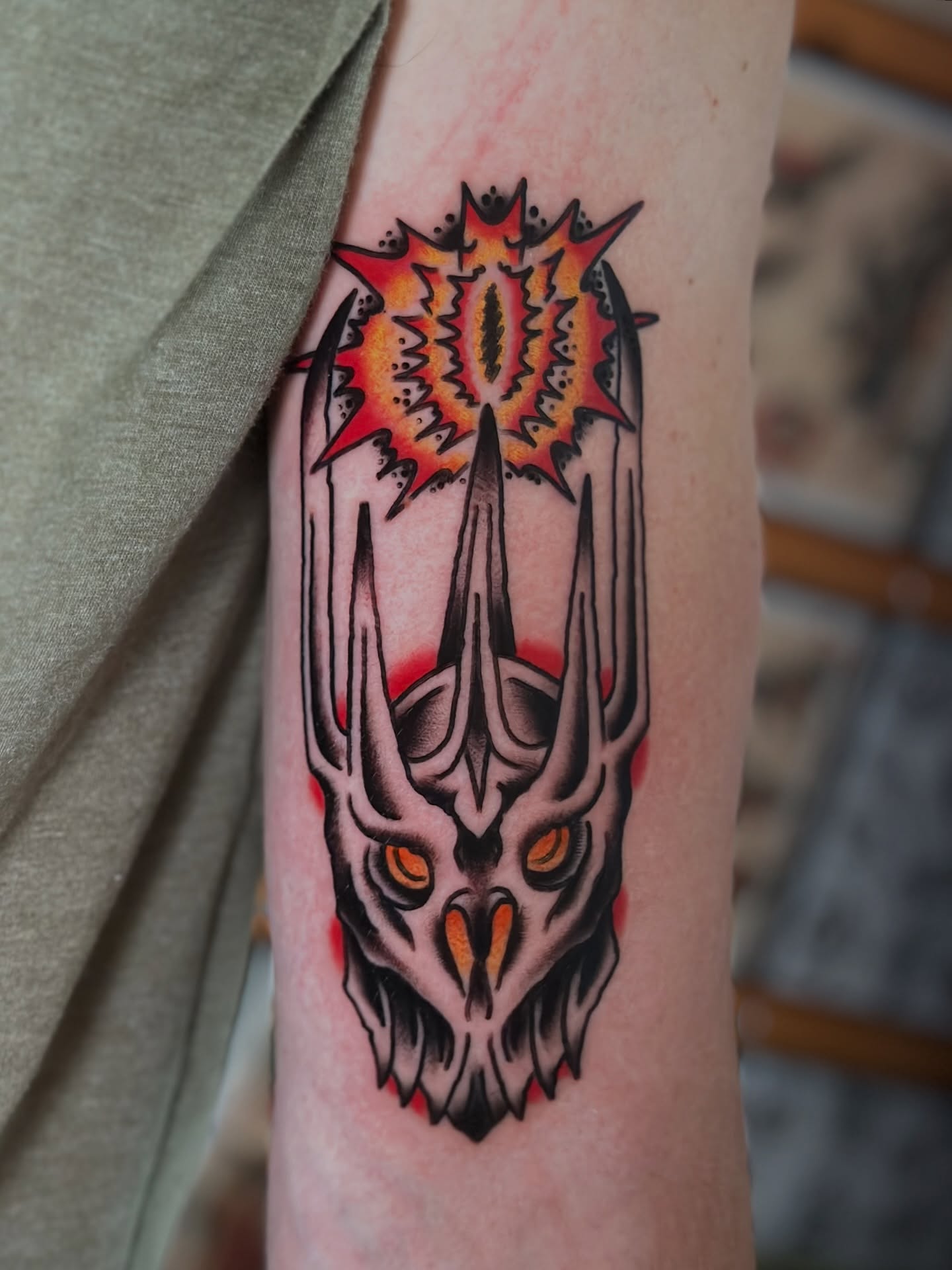 Demon skull American traditional tattoo on the forearm by Michael Williams