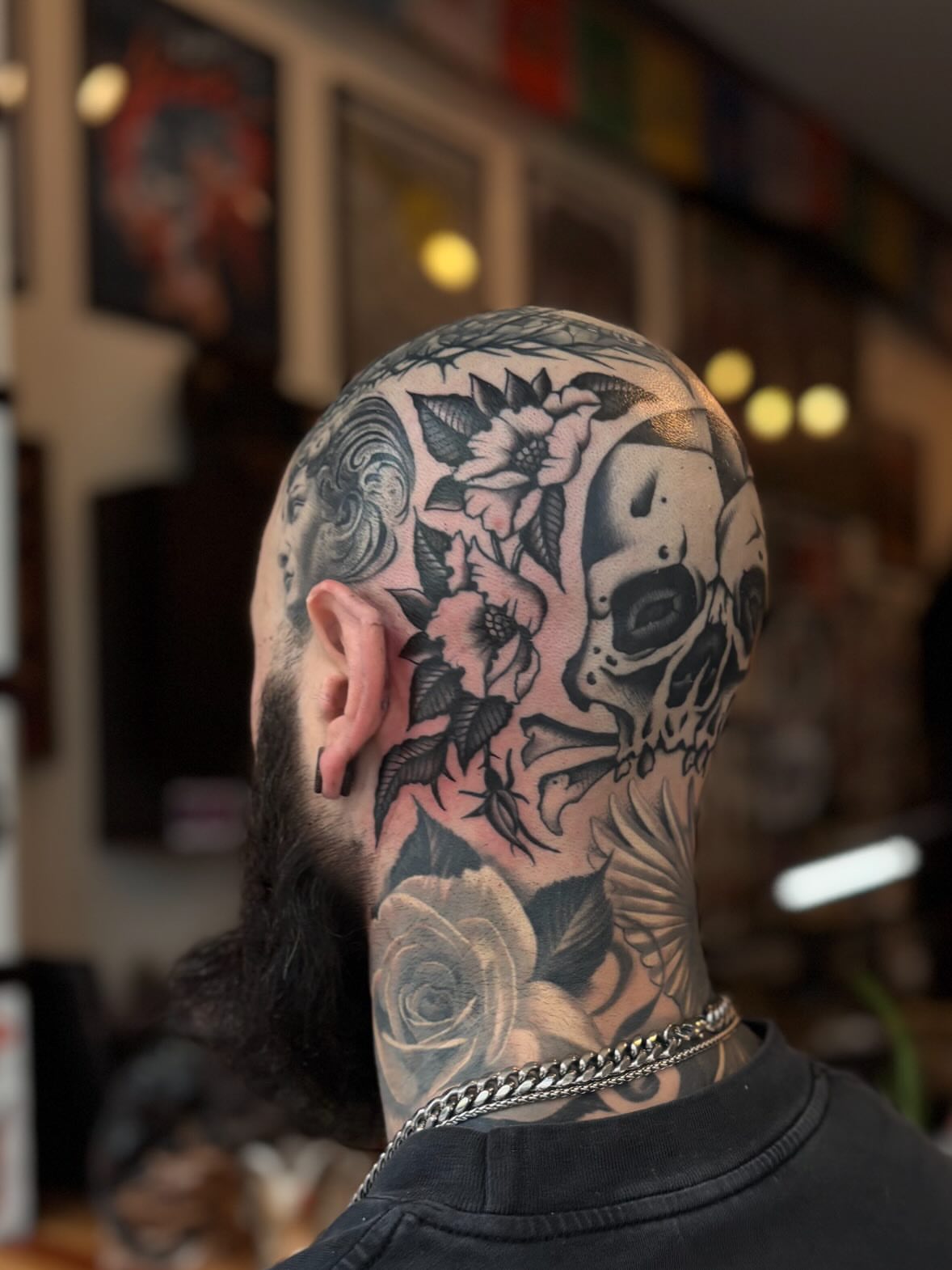 Skull and floral realism tattoo on the neck by Jesse Smith, Chicago, Illinois