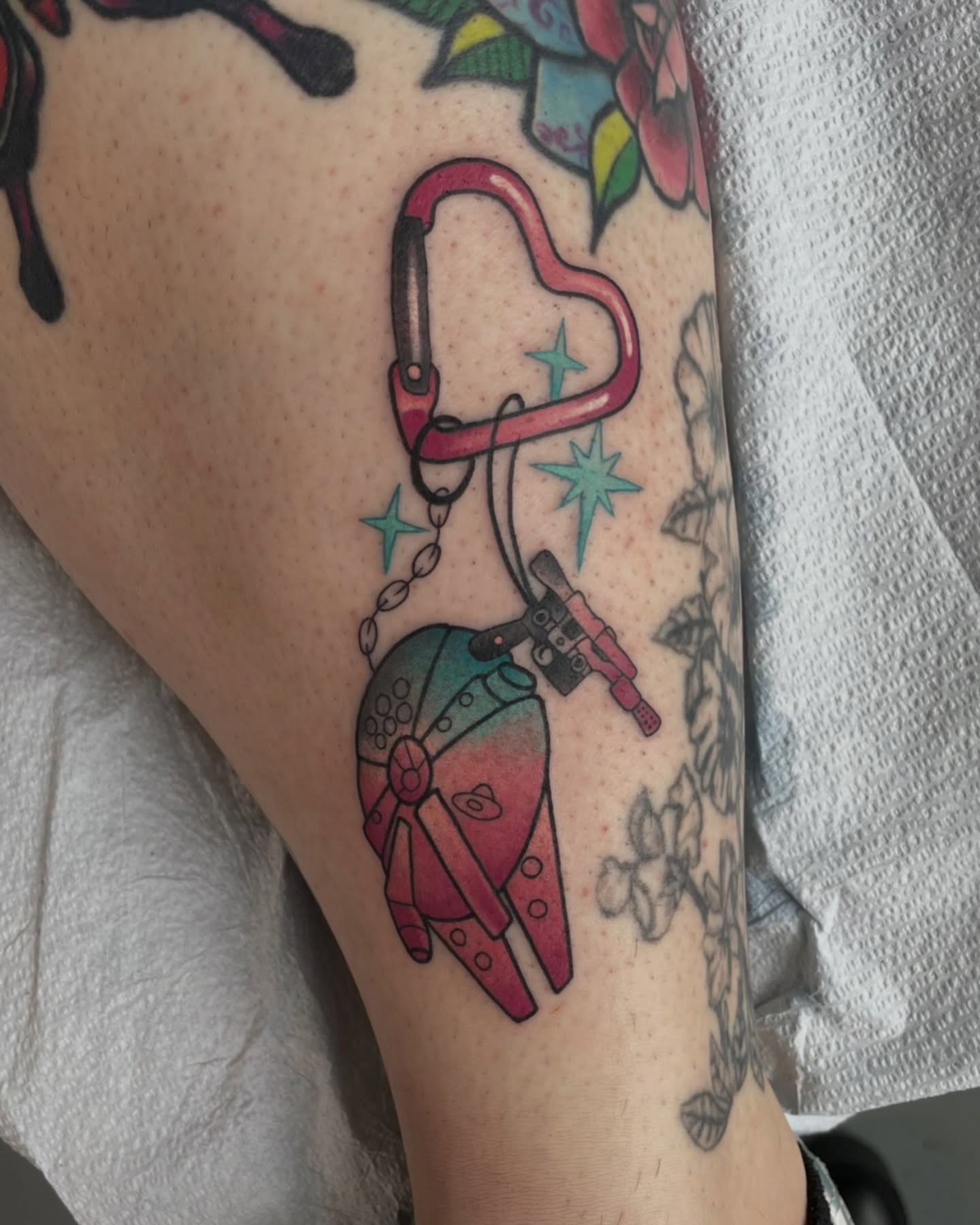 Space-themed pendant new school tattoo on the forearm by Sam Castro