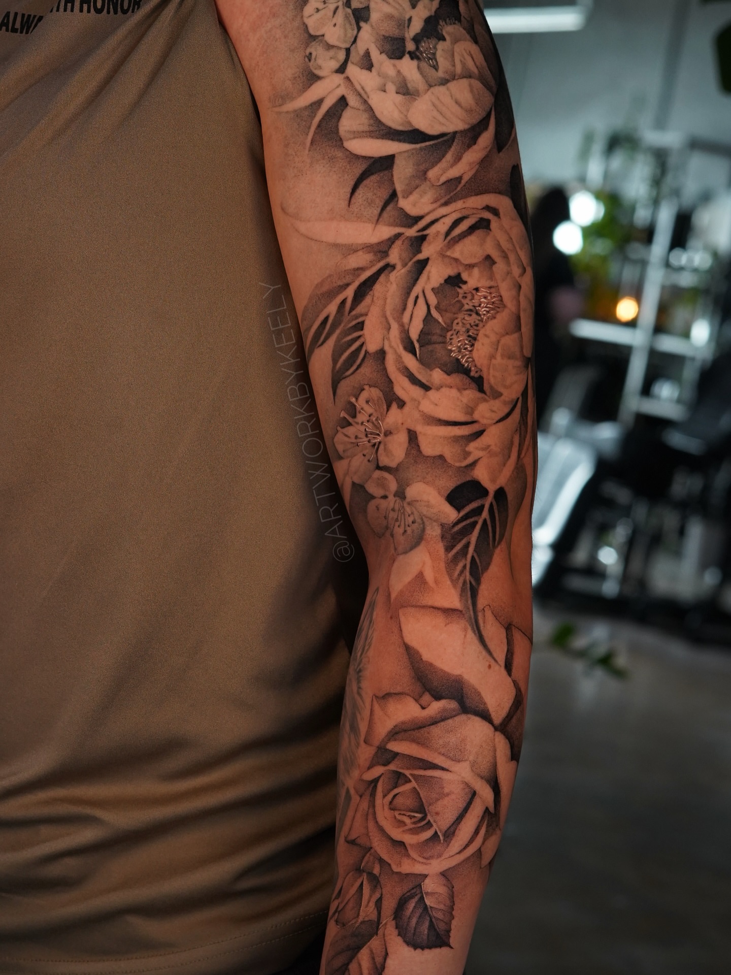 Flowers realism tattoo on the forearm by Keely Thompson