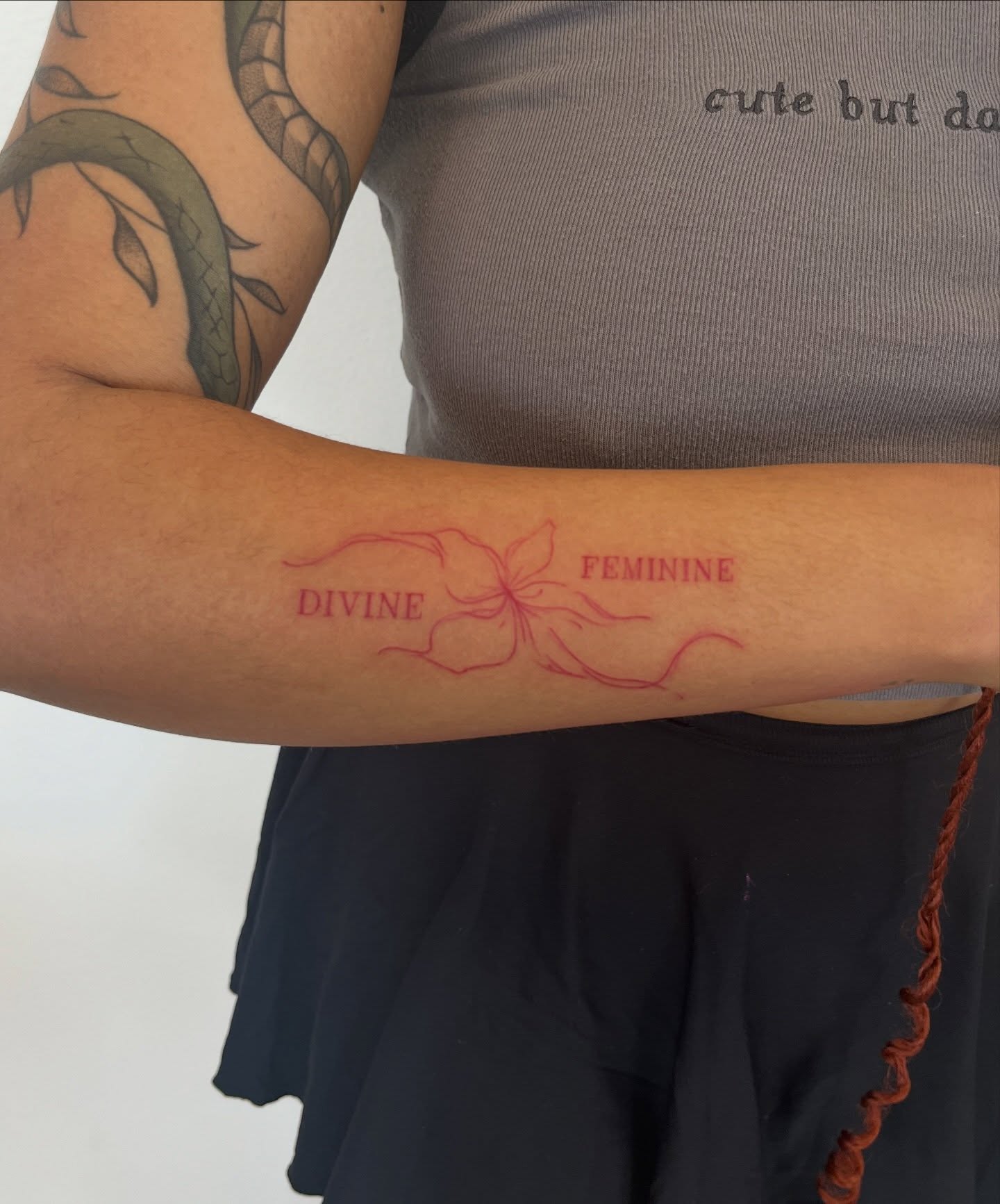 Flower fine line tattoo on the forearm by kt