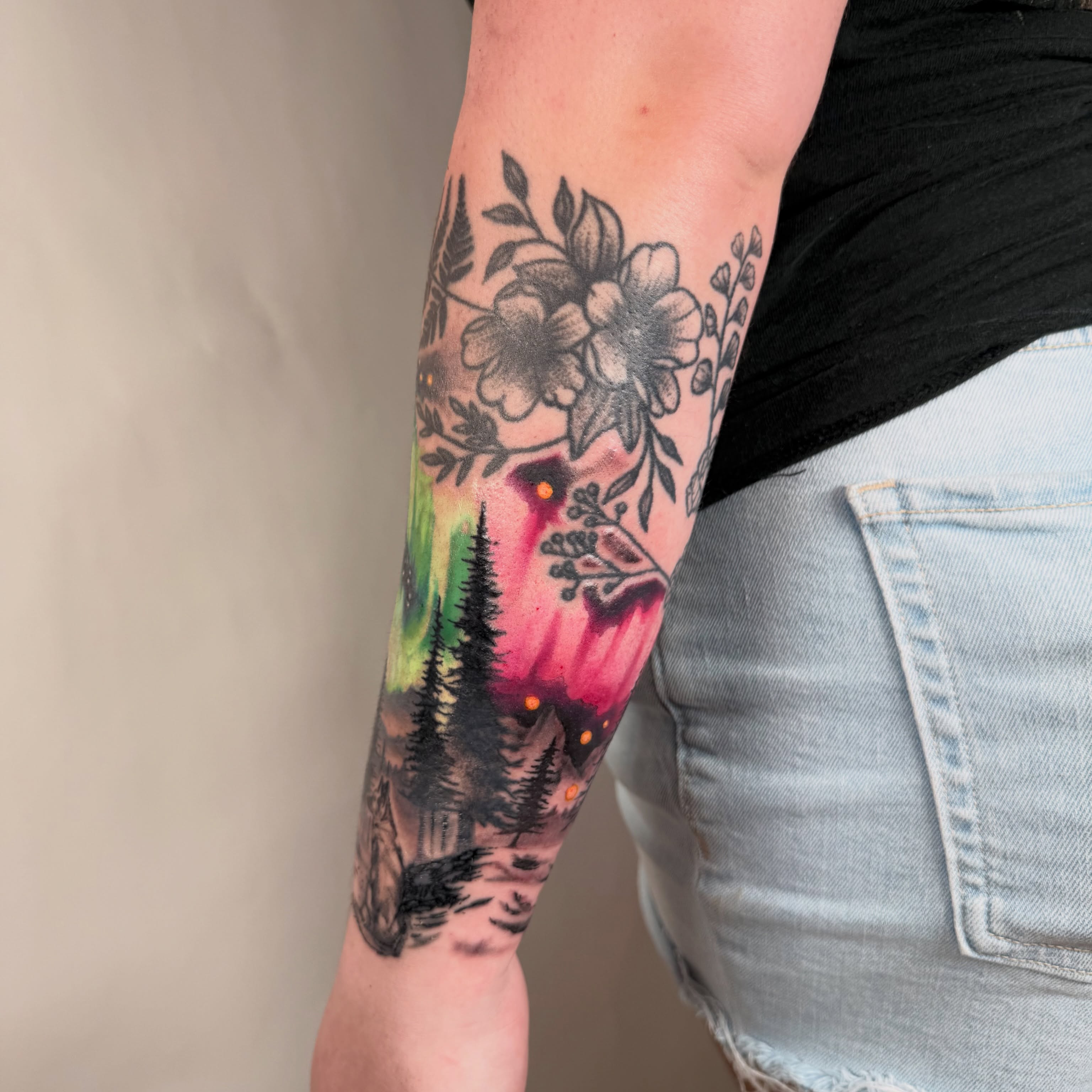 Forest landscape dotwork tattoo on the forearm by autumn sky