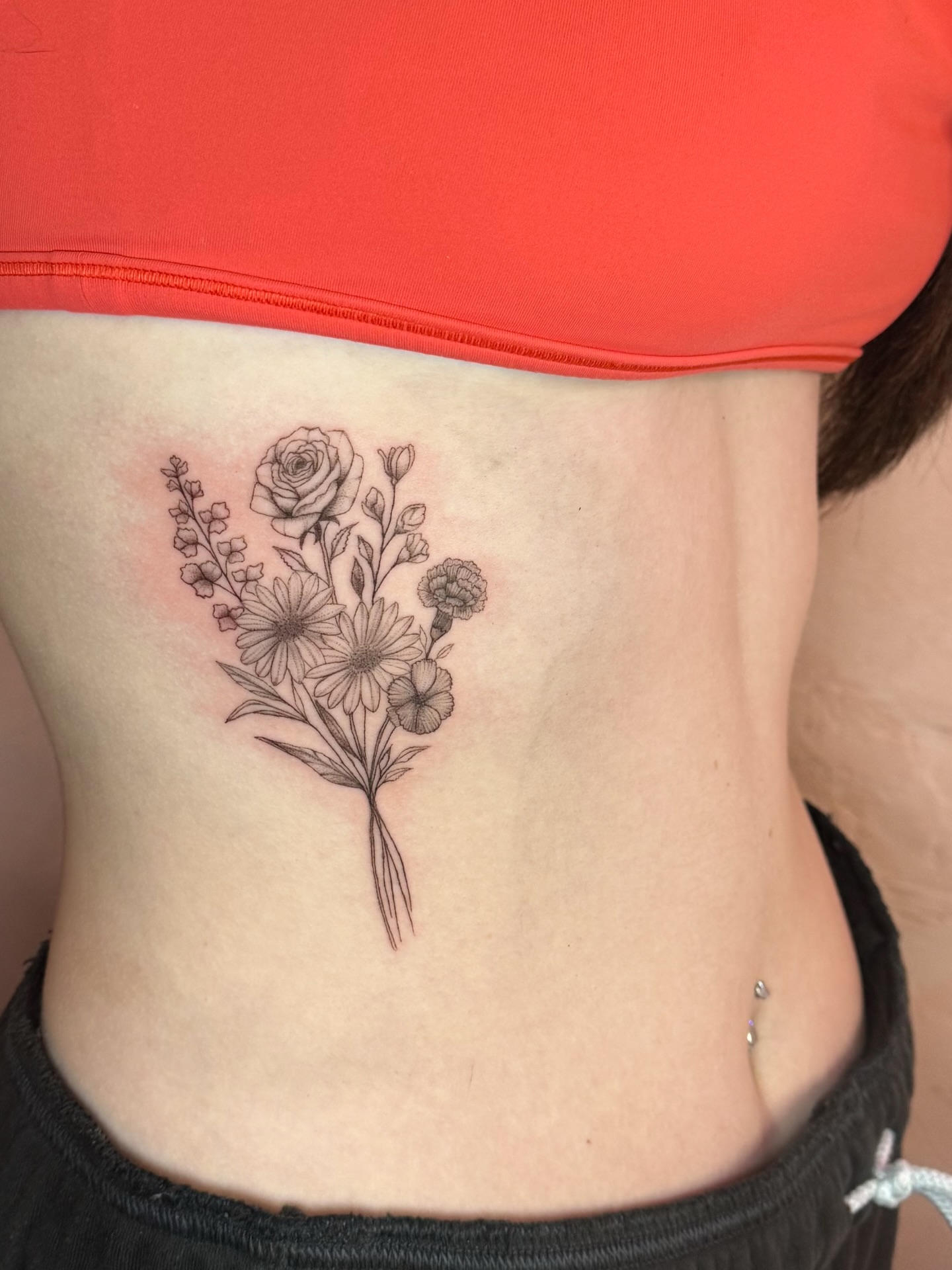 Floral bouquet black and grey tattoo on the ribs by fine line tattoo artist▪️Austin TX