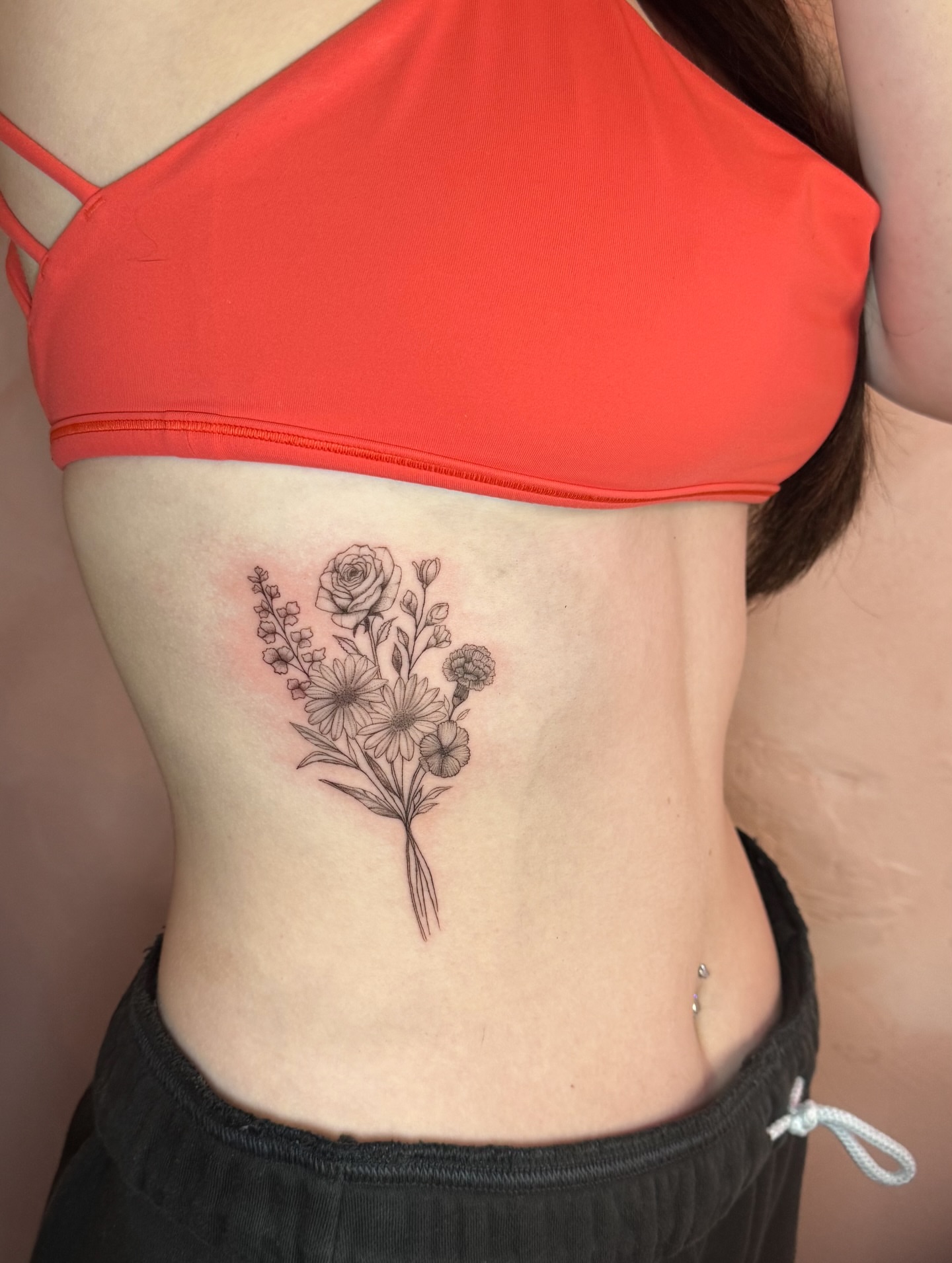 Floral bouquet black and grey tattoo on the ribs by fine line tattoo artist▪️Austin TX