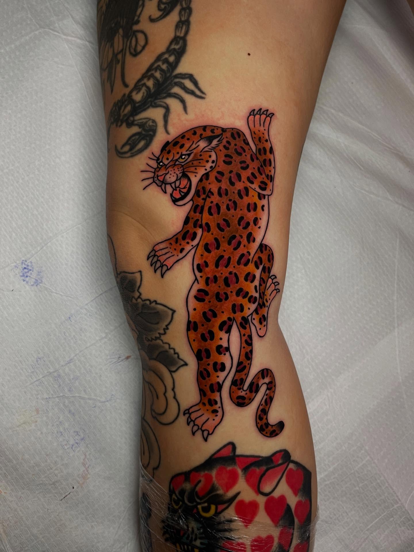 Leopard American traditional tattoo on the forearm by Marqui Watling