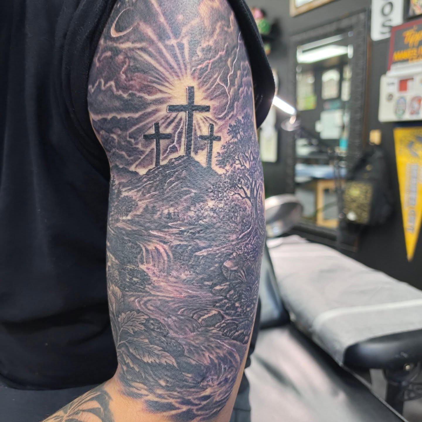 Three crosses realism tattoo on the forearm by Robert Glover