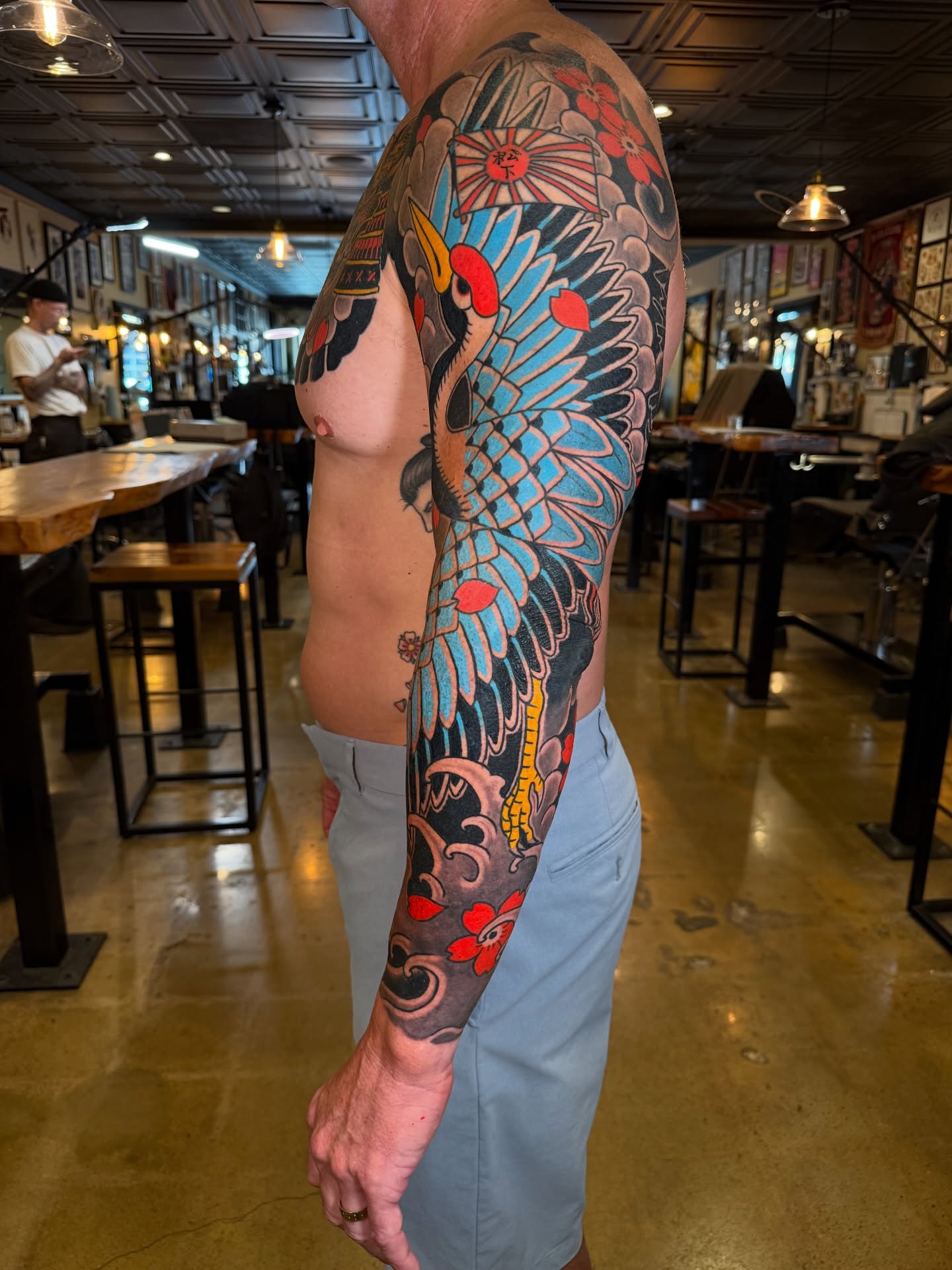 Crane and waves japanese irezumi tattoo on the upper arm by Tyler Brown, San Diego, California