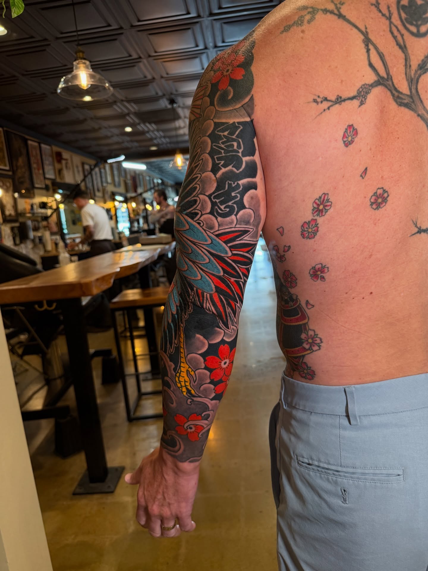 Cherry blossoms and tree japanese irezumi tattoo on the upper arm by Tyler Brown, San Diego, California