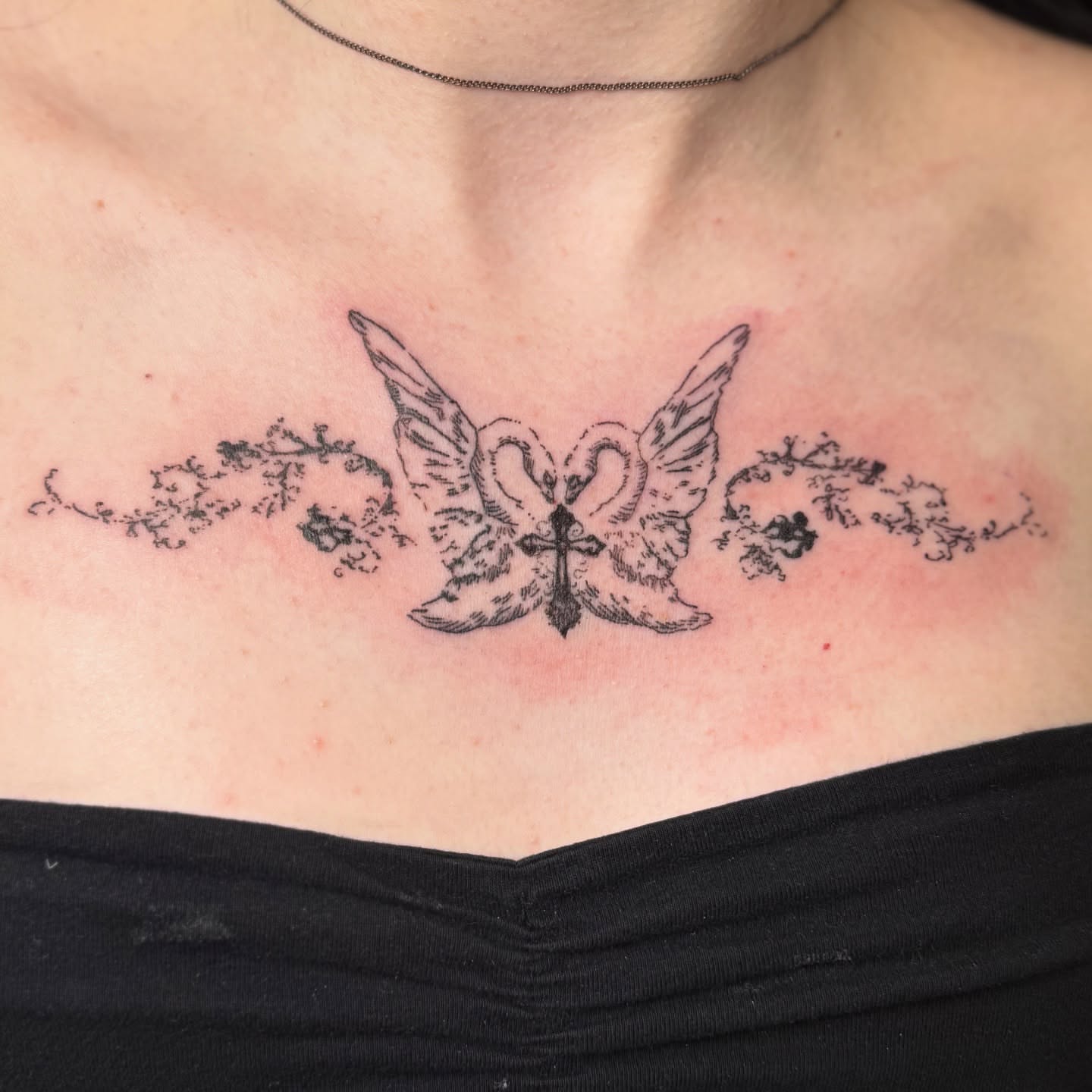 Swans and cross black and grey tattoo on the chest by 🌸Blossom🌸