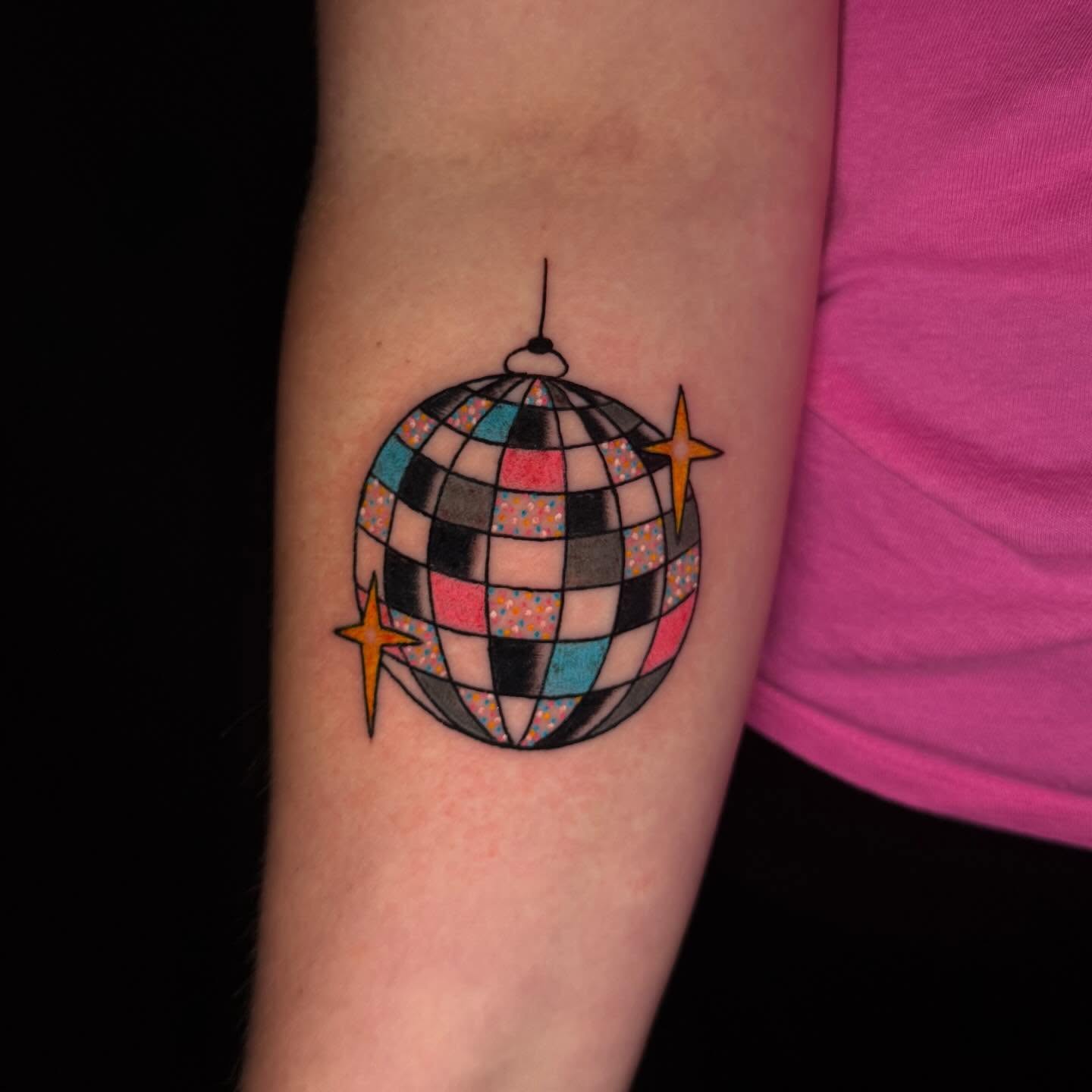 Disco ball geometric tattoo on the forearm by Mallory Brown