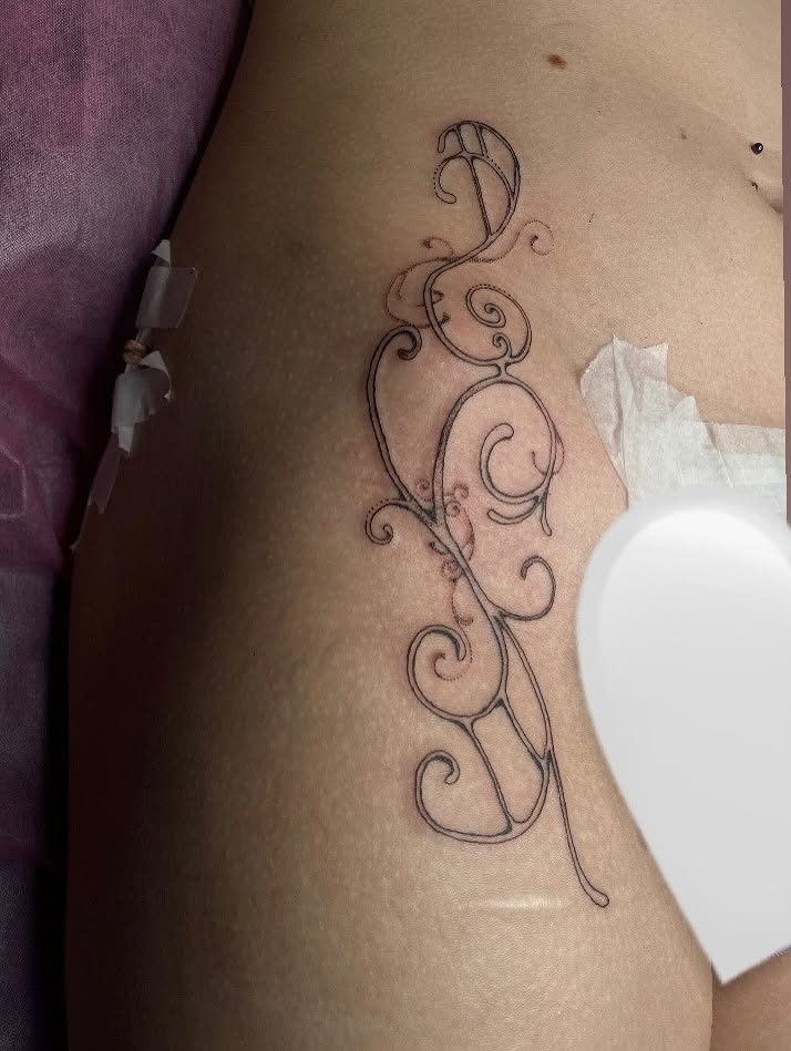 Swirls fine line tattoo on the thigh by sarah 🗝️