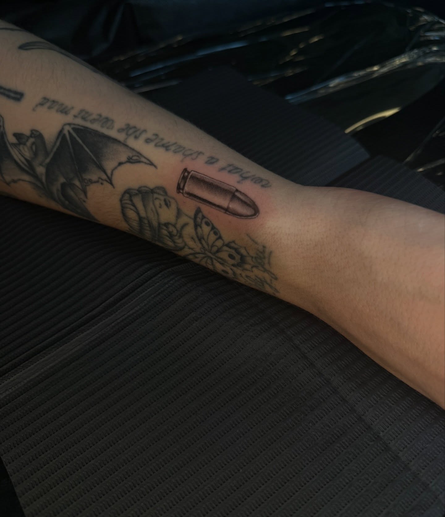 Bullet black and grey tattoo on the forearm by Kait