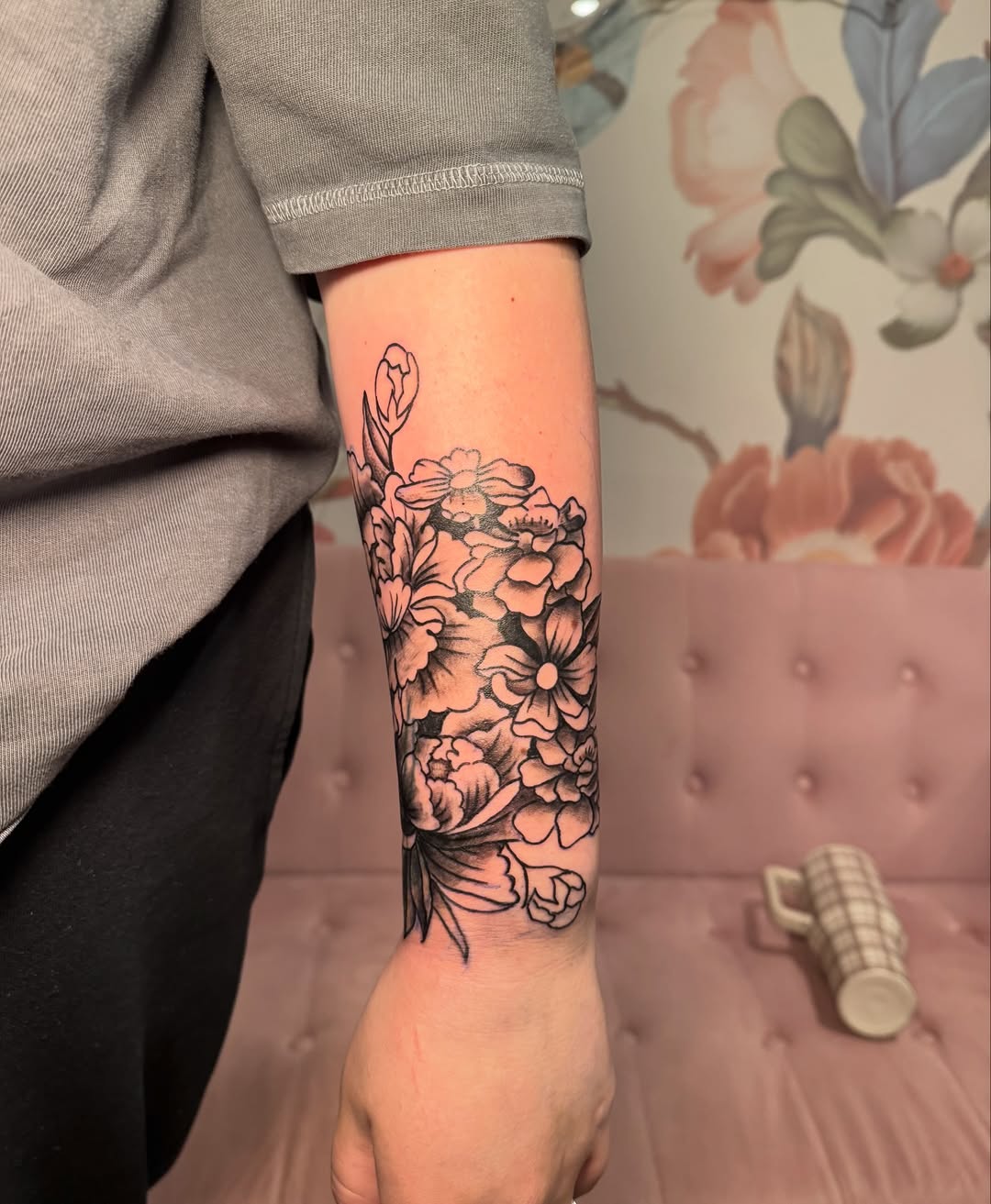 Floral bouquet dotwork tattoo on the forearm by Kinzi Brown