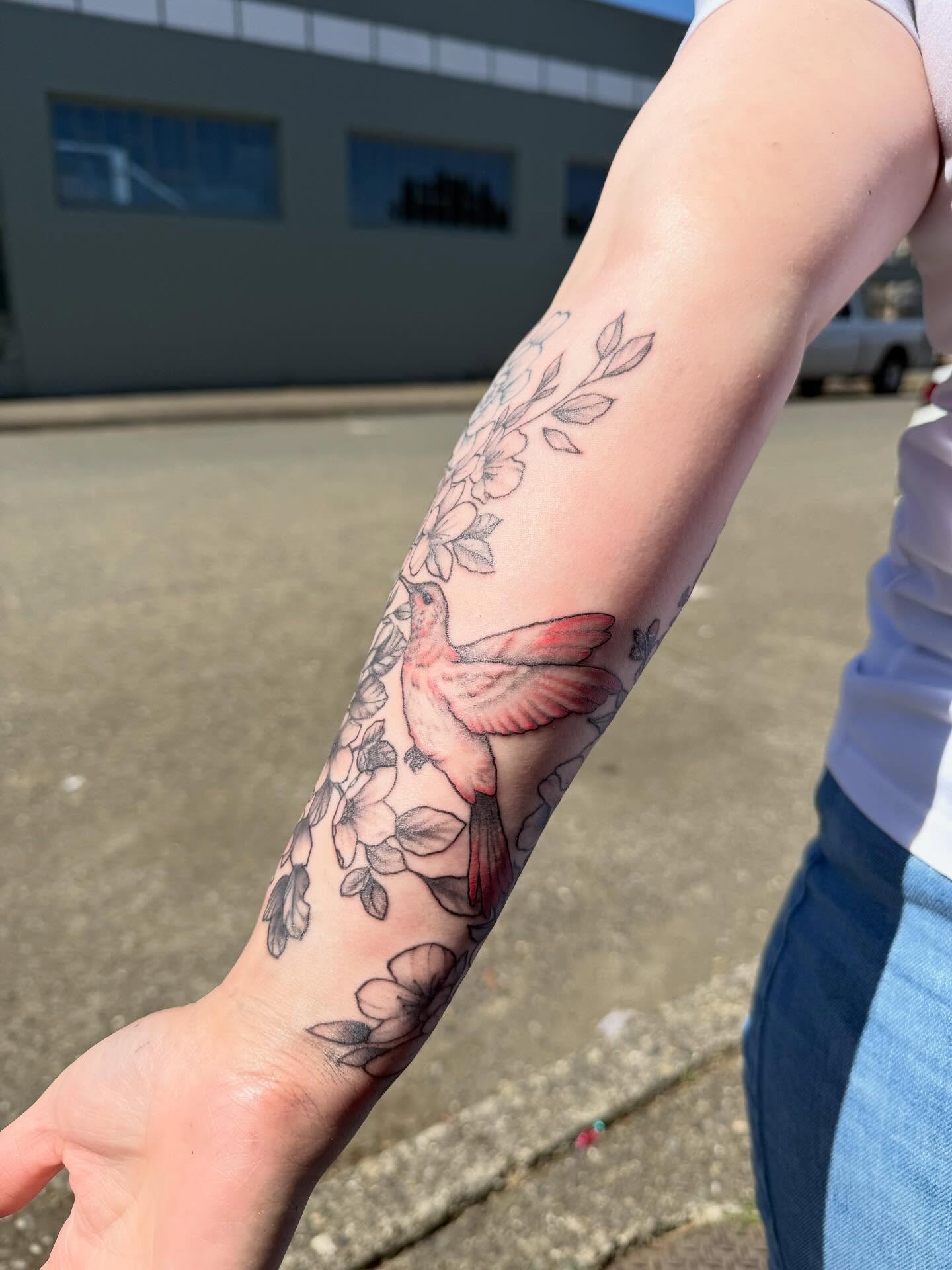 Bird and flowers new school tattoo on the forearm by Harlow ❤️‍🔥