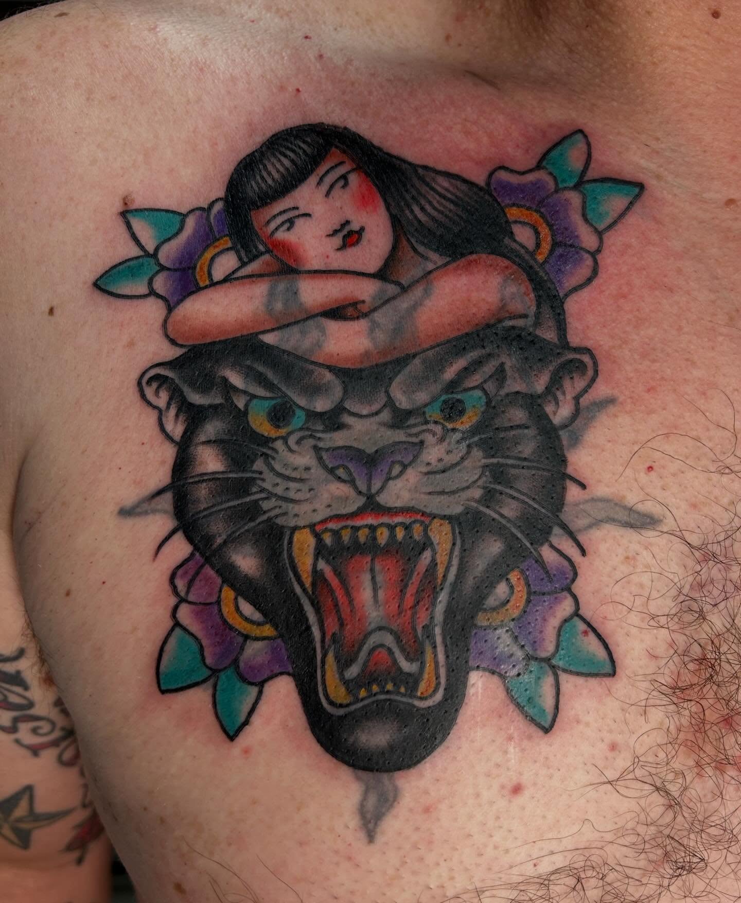 Panther and woman American traditional tattoo on the chest by Hannah Jean