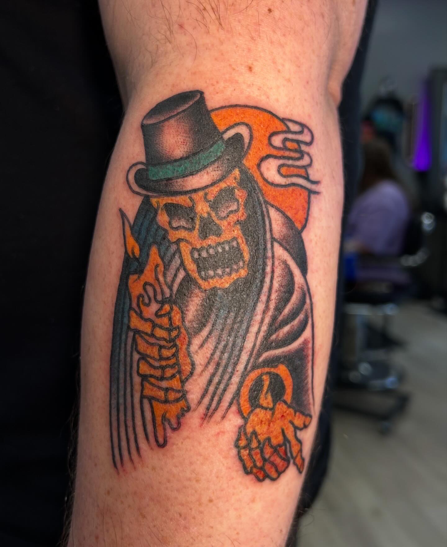 Skull in top hat American traditional tattoo on the forearm by Hannah Jean