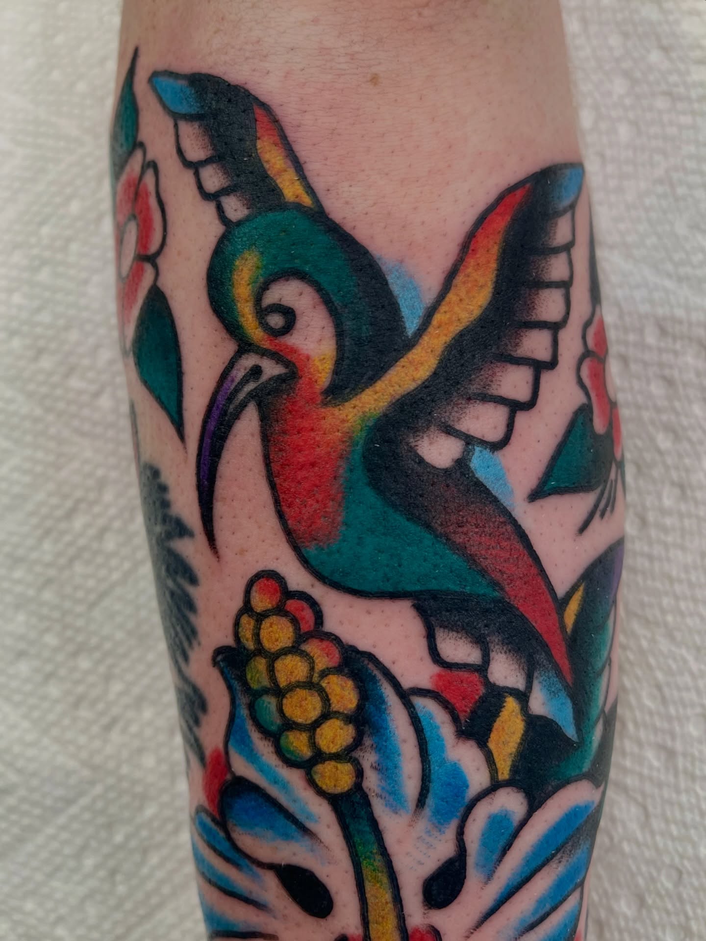 Hummingbird American traditional tattoo on the forearm by Alex Garcia - Sac City Tattoo