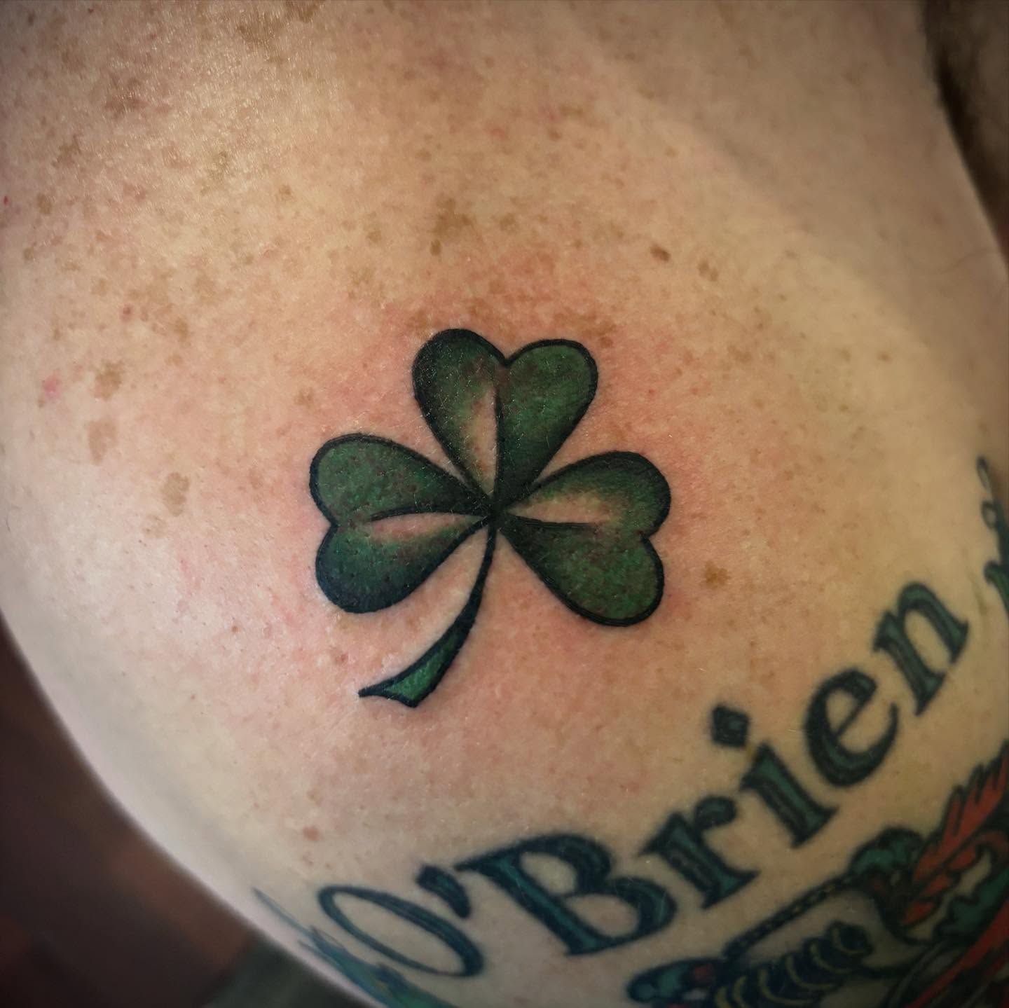 Clover American traditional tattoo on the chest by Danny DiBlasi, San Francisco, California