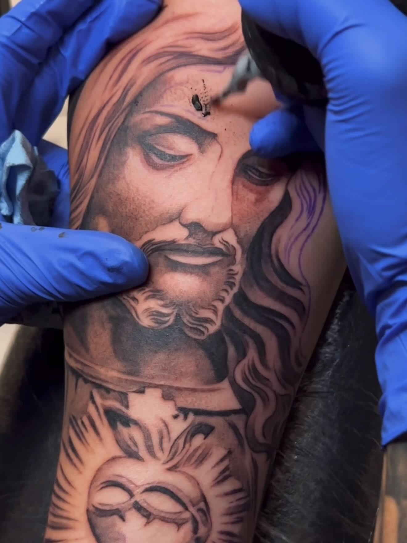Religious figure realism tattoo on the forearm by Adrian gonzalez...