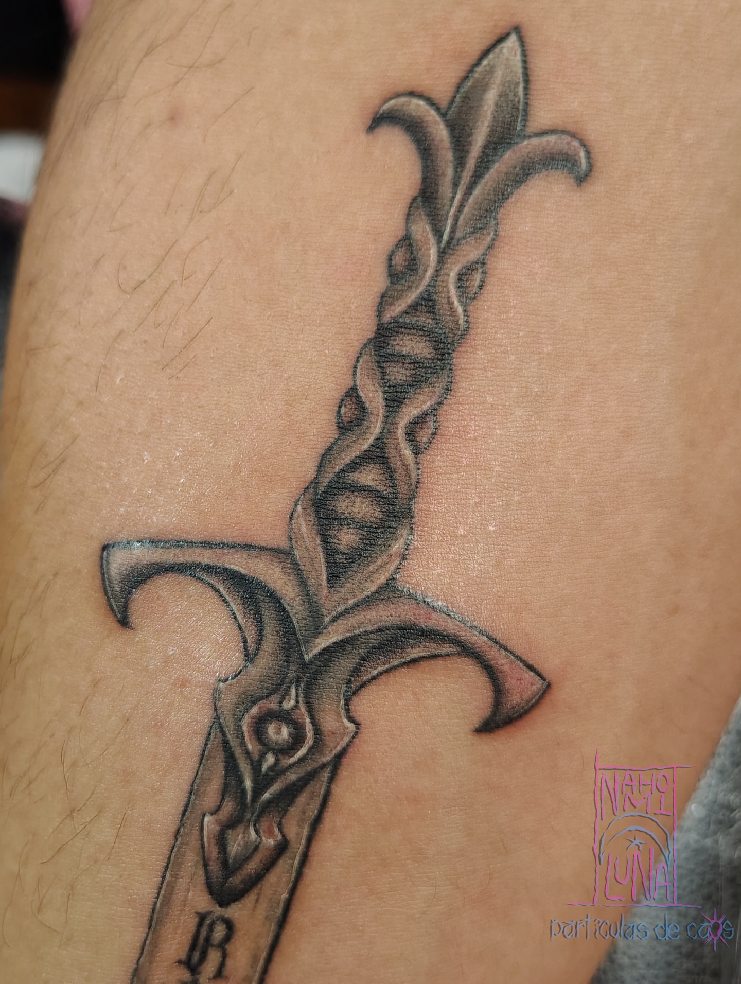 Sword black and grey tattoo on the forearm by Nahomi Luna - Memphis & Cordova Tattoo, Memphis, Tennessee