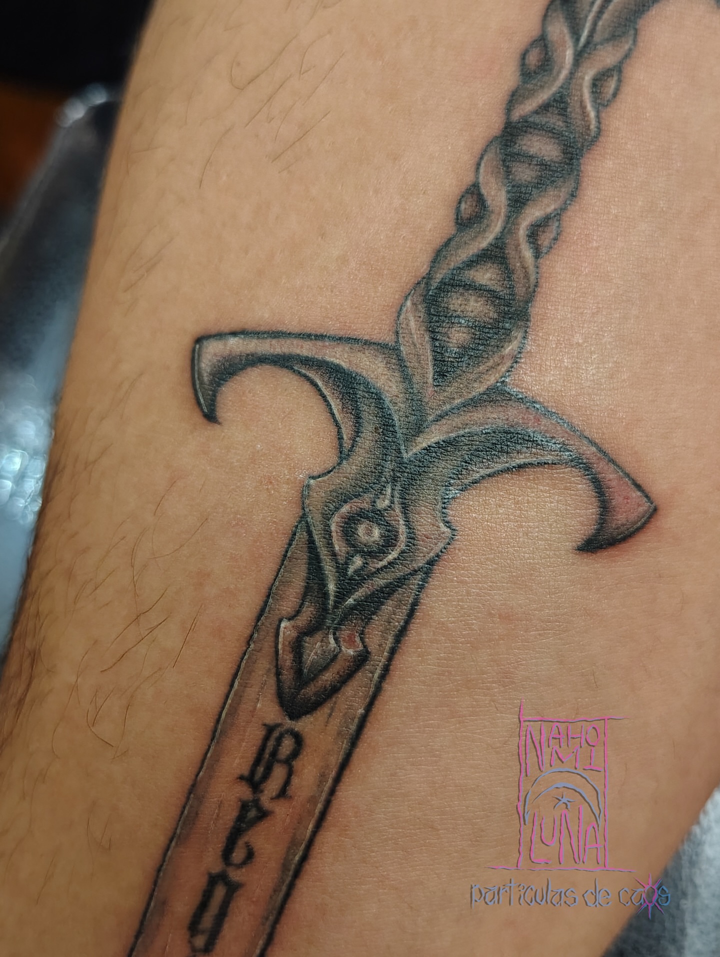 Sword black and grey tattoo on the forearm by Nahomi Luna - Memphis & Cordova Tattoo, Memphis, Tennessee