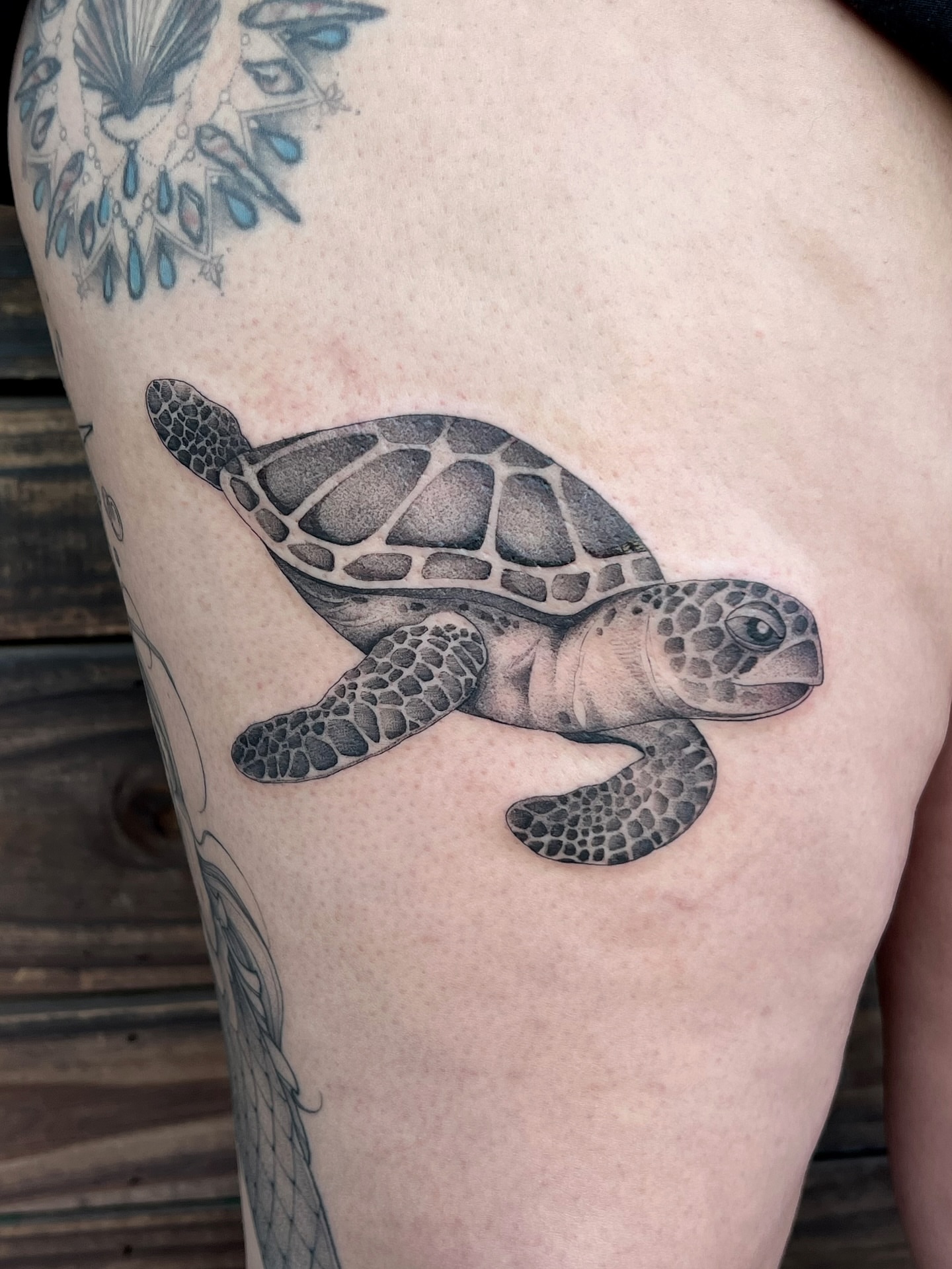 Turtle black and grey tattoo on the thigh by Tehnaya