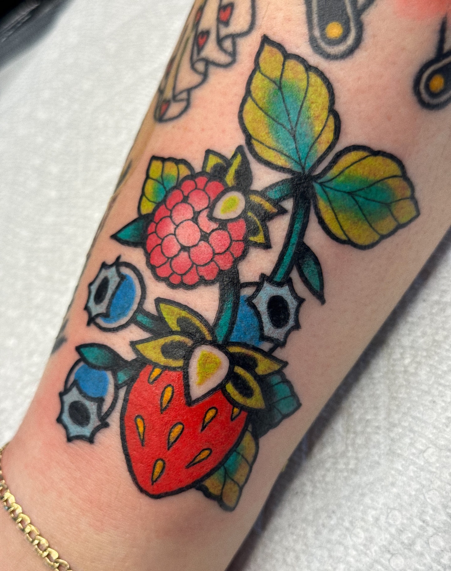 Fruit and berry American traditional tattoo on the forearm by 𝕷𝖆𝖚𝖗 𝕷𝖆𝖚𝖗