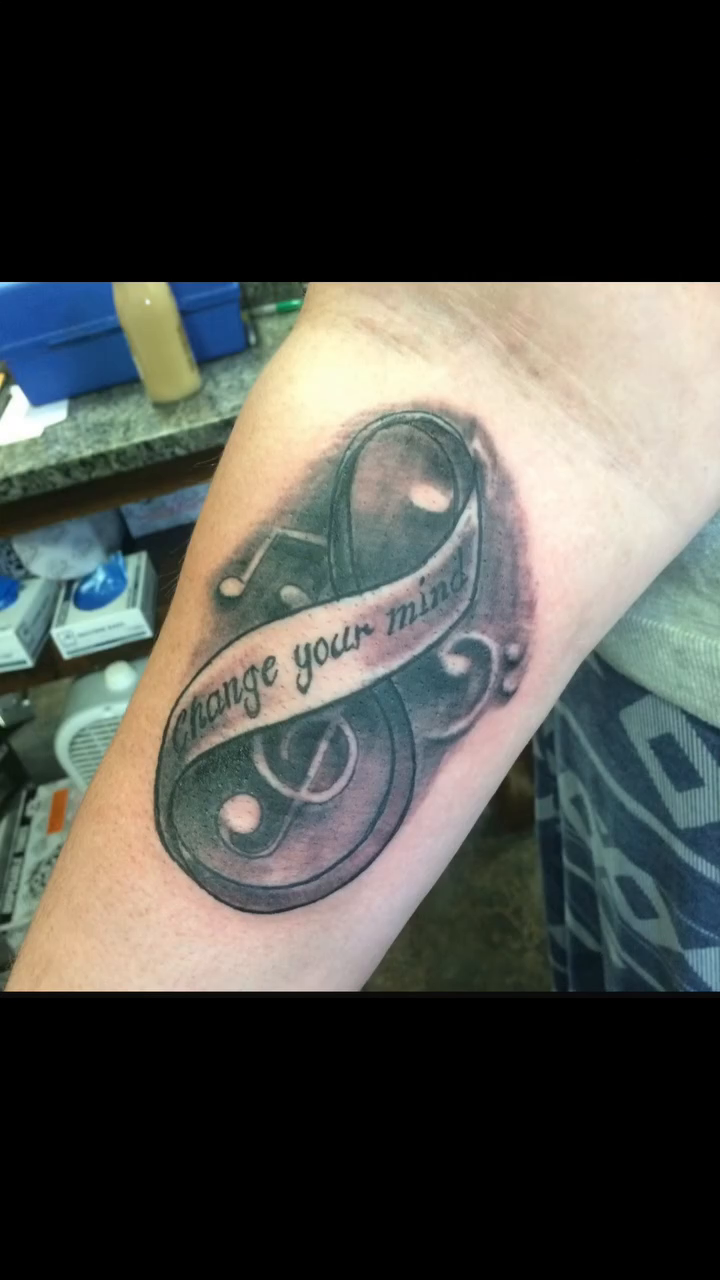 Tattoo on the forearm by Karen Cain