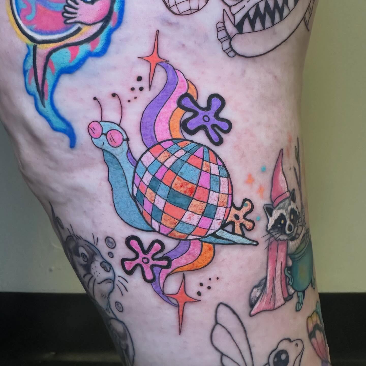 Snail new school tattoo on the thigh by Sam, Mount Laurel, New Jersey
