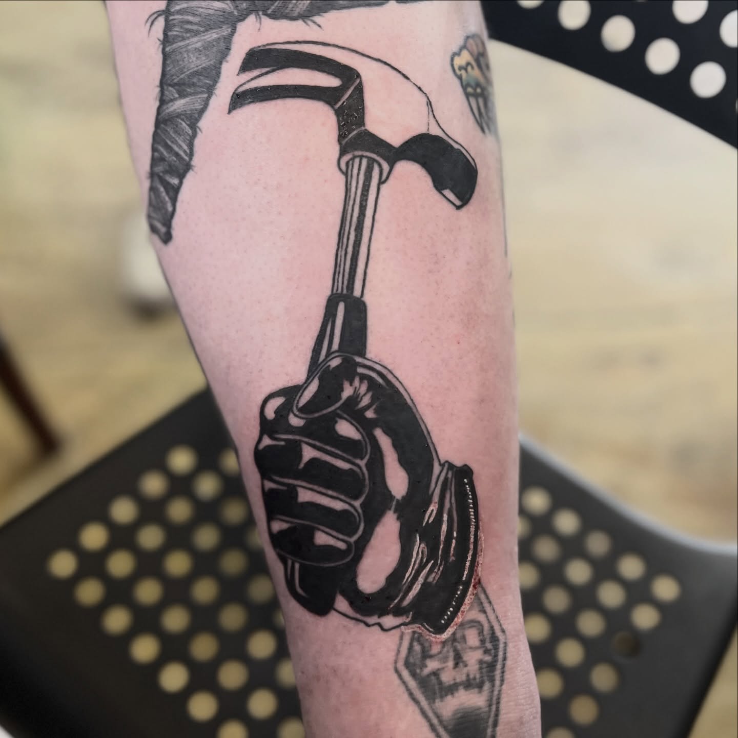 Hammer black and grey tattoo on the forearm by Alex Santaloci