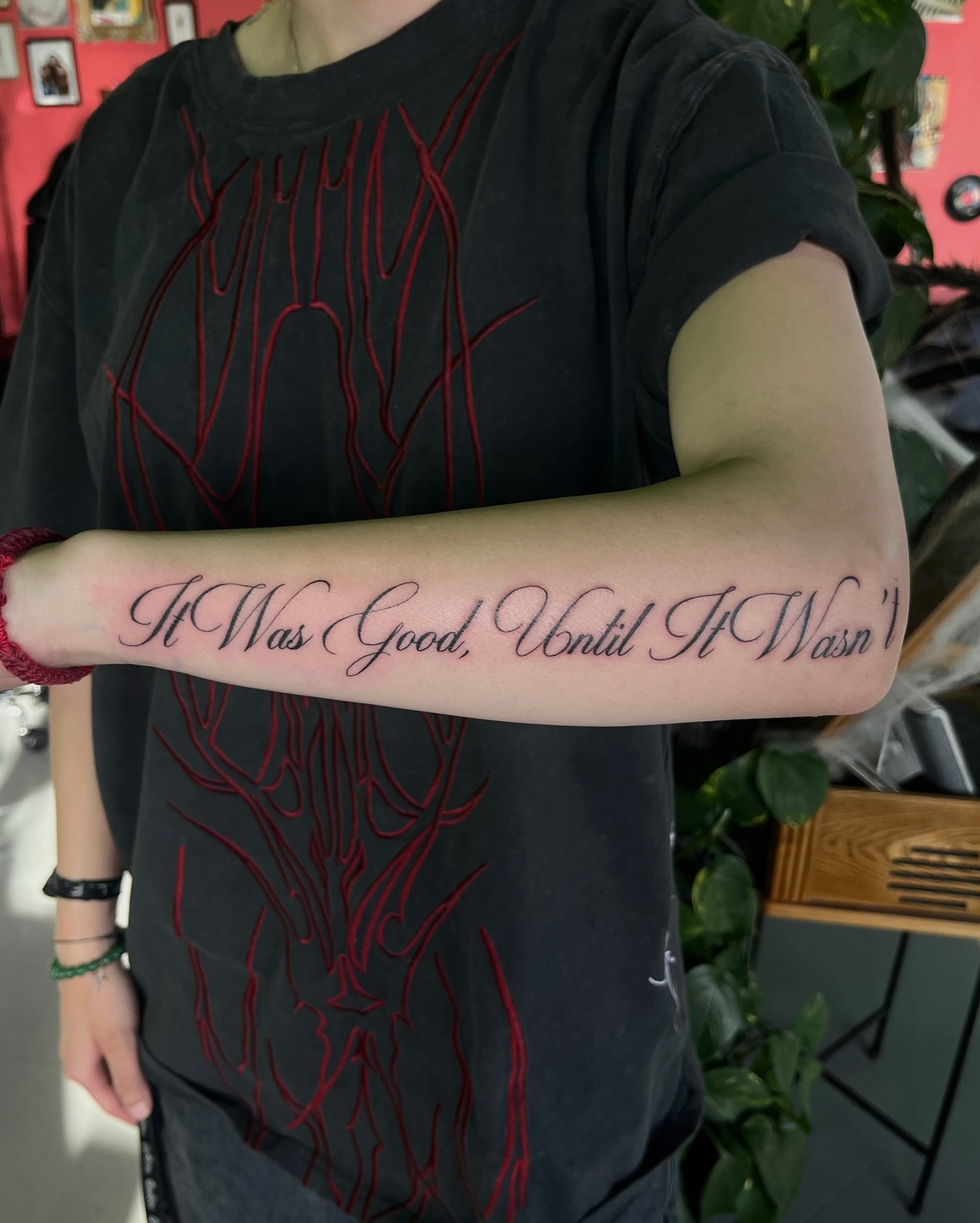 It Was Good, Until It Wasn’t lettering script tattoo on the forearm by Daniela