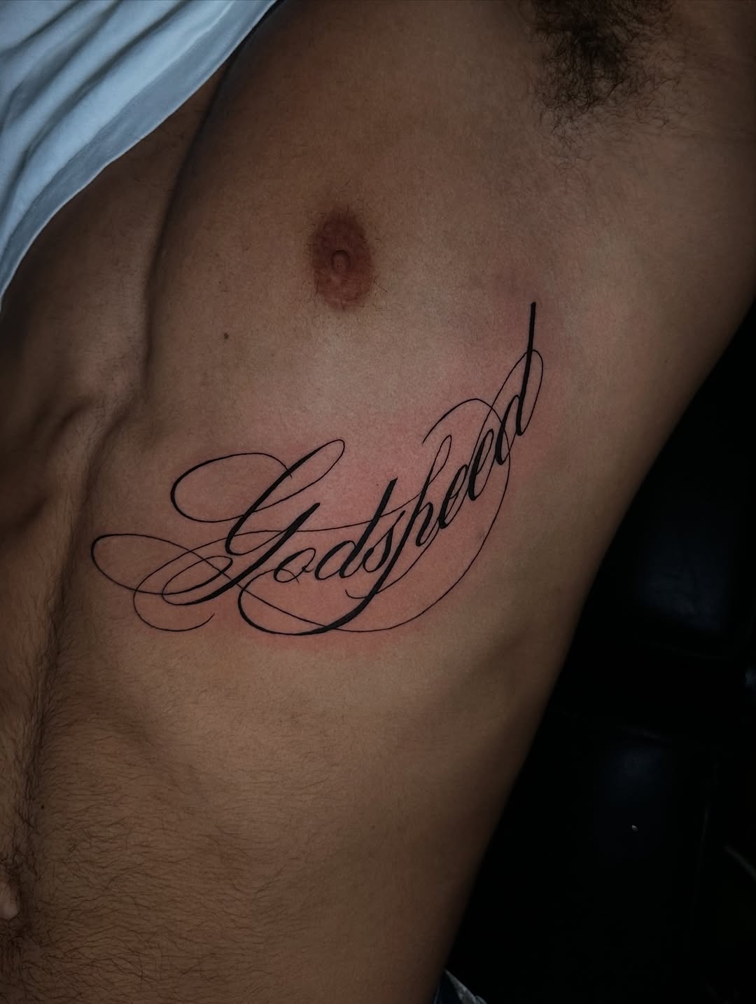 Script lettering lettering tattoo on the chest by Chris (Pikasso)