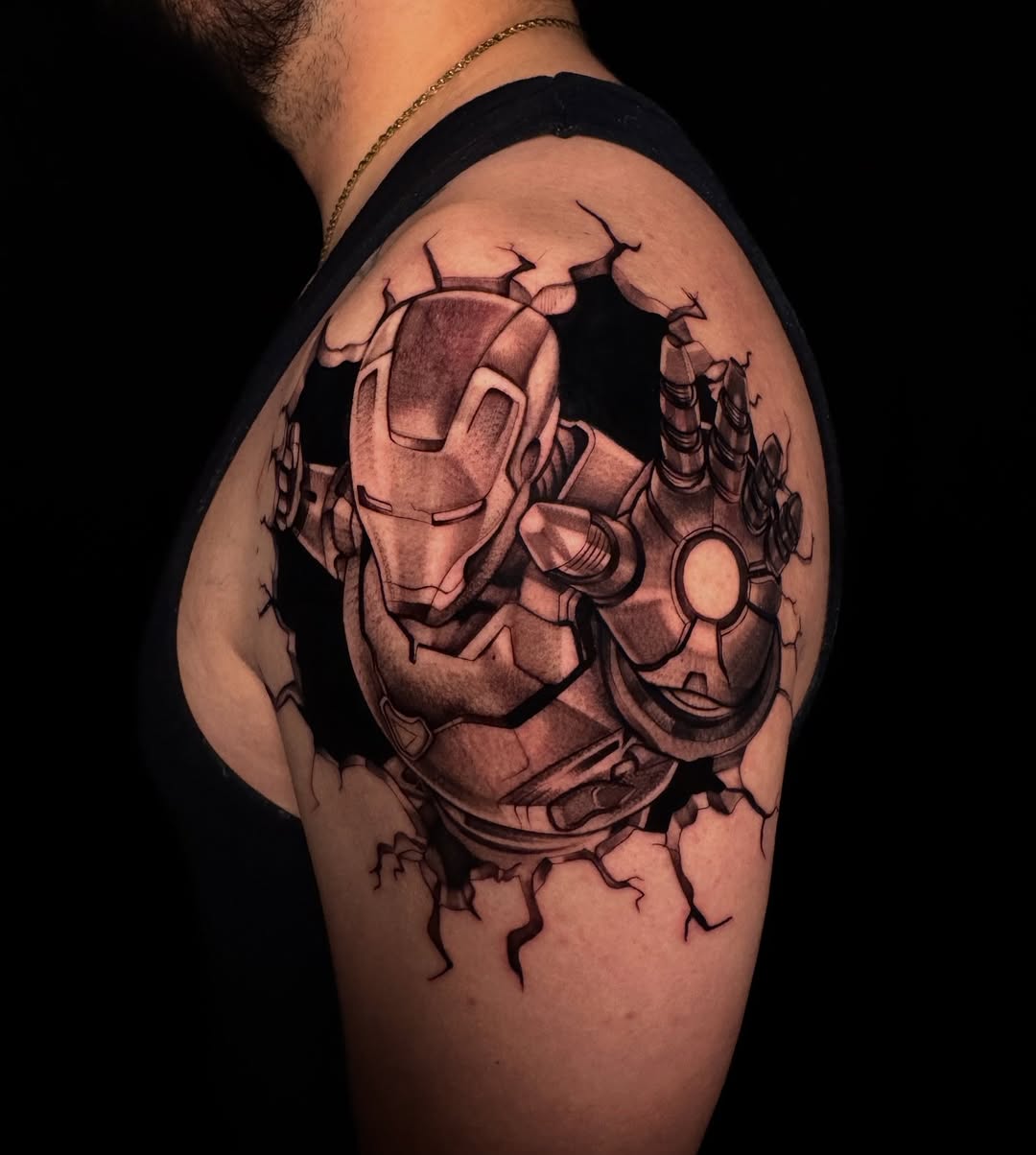 Iron Man breaking through skin new school tattoo on the shoulder by Austin Tattoo Artist, Austin, Texas