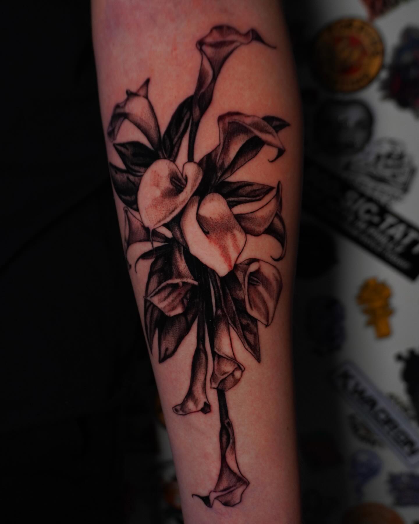 Calla lilies black and grey tattoo on the forearm by hallow ☣︎ tattoo artist, Philadelphia, Pennsylvania