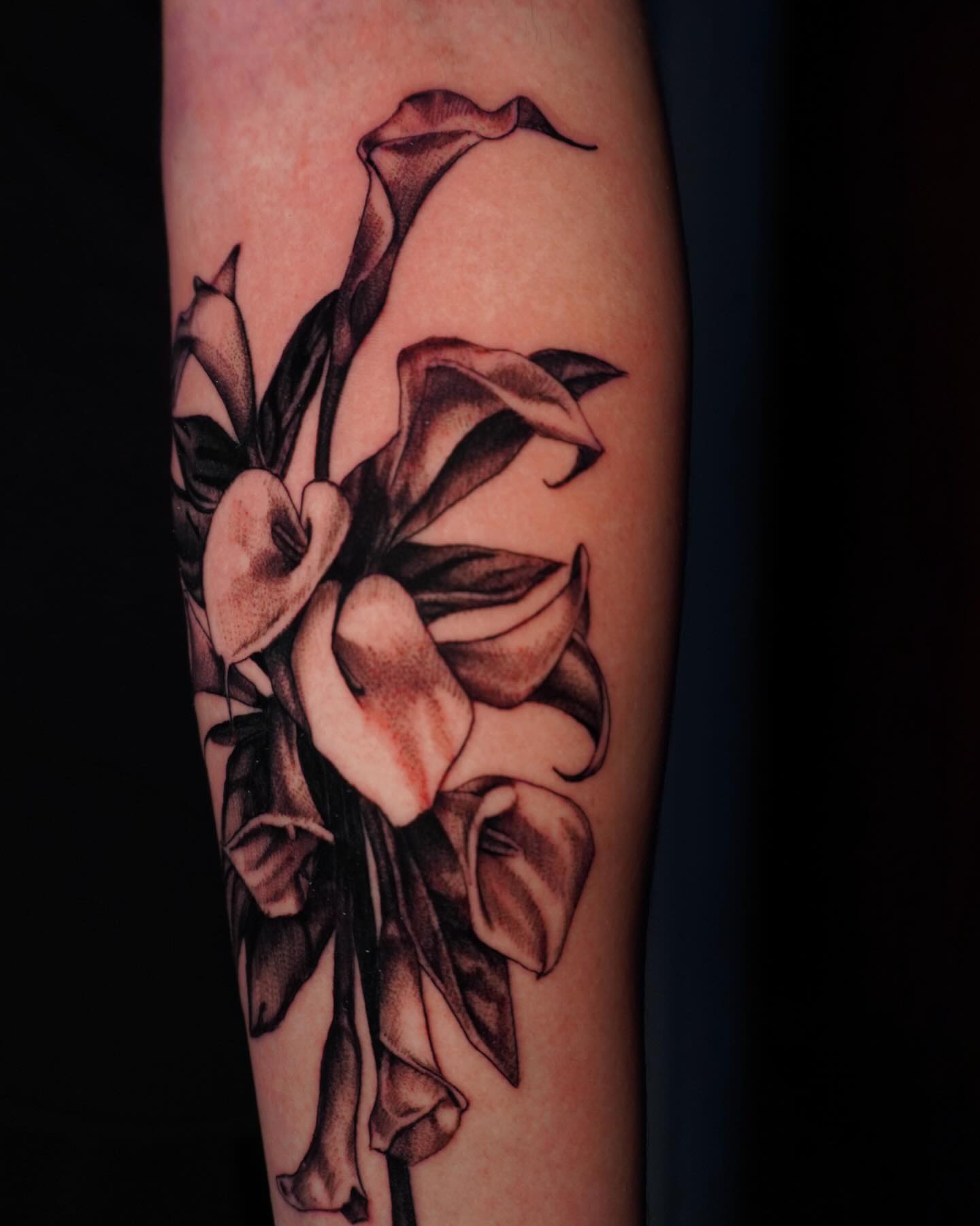 Calla lilies black and grey tattoo on the forearm by hallow ☣︎ tattoo artist, Philadelphia, Pennsylvania