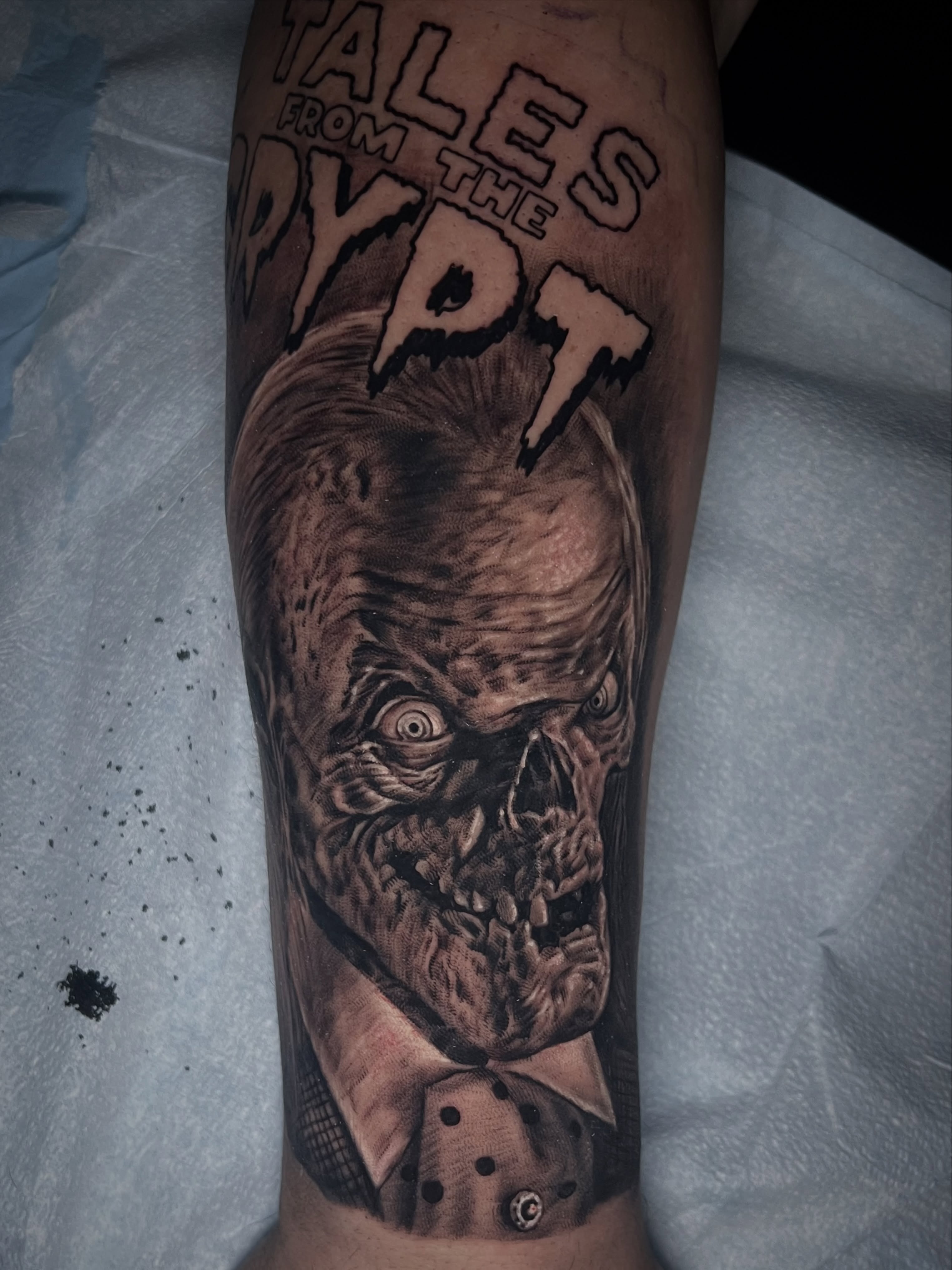 Tales from the Crypt realism tattoo on the forearm by AAron Packard