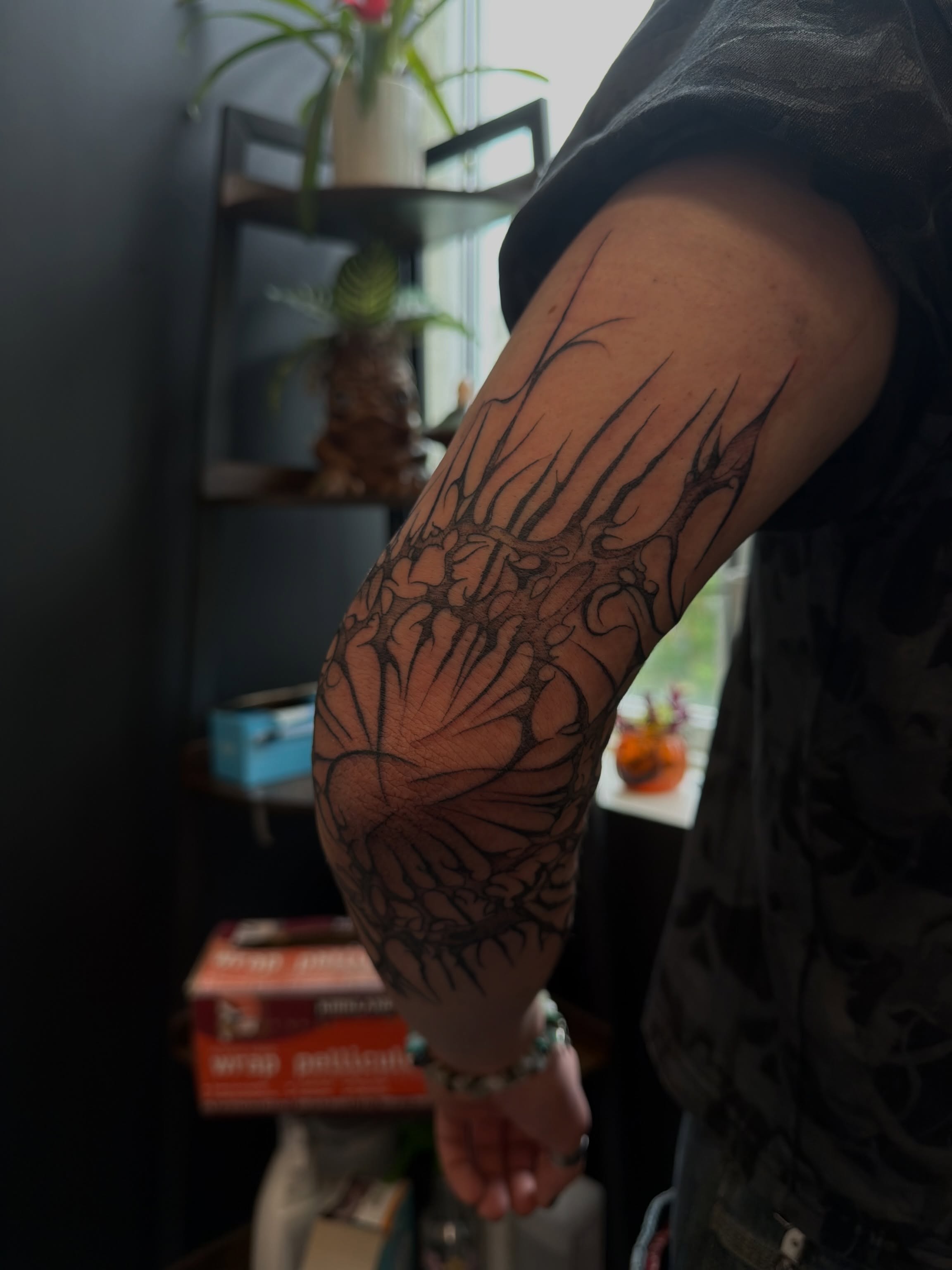 Floral design black and grey tattoo on the forearm by ashlyn rene