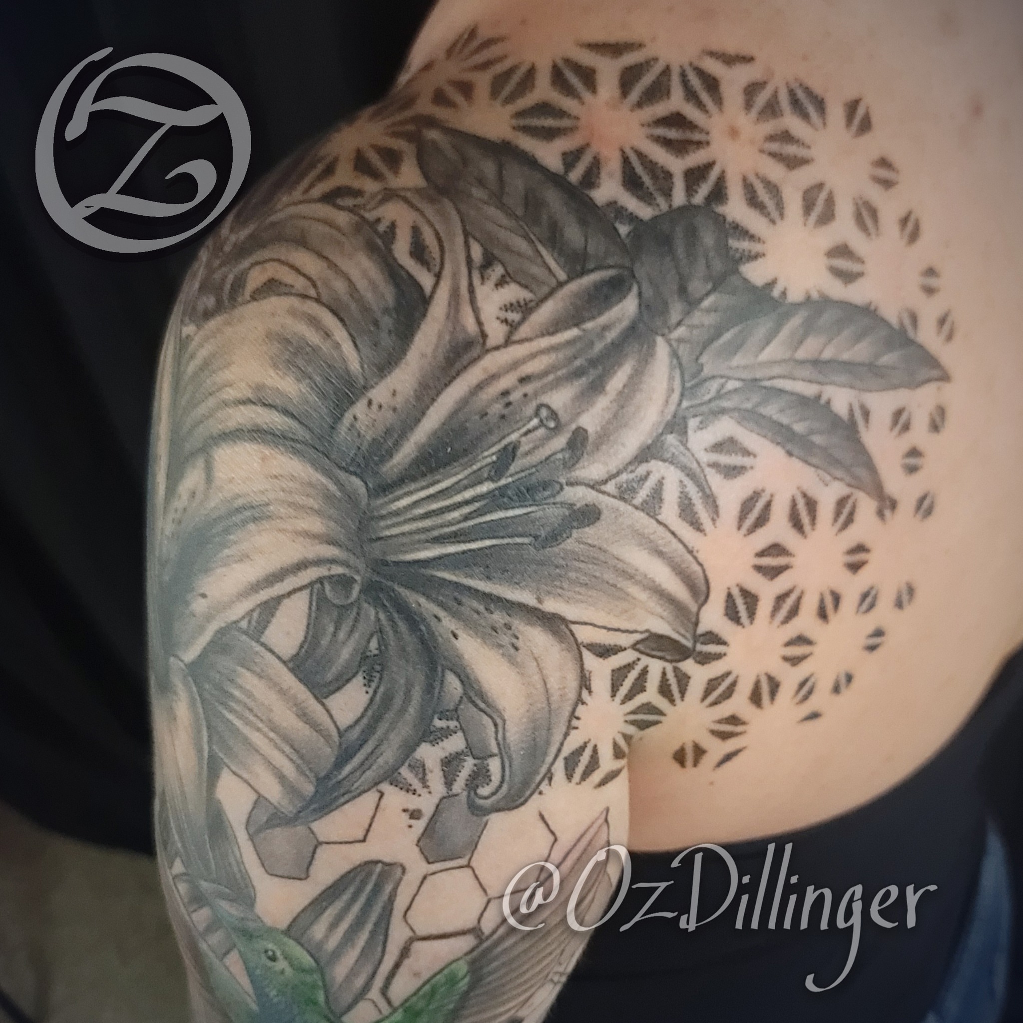 Lily realism tattoo on the shoulder by Oz Dillinger