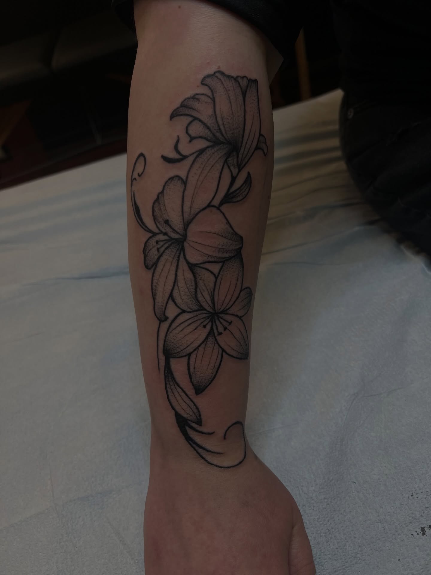 Lilies dotwork tattoo on the forearm by Fizzy Jizzles, Worcester, England