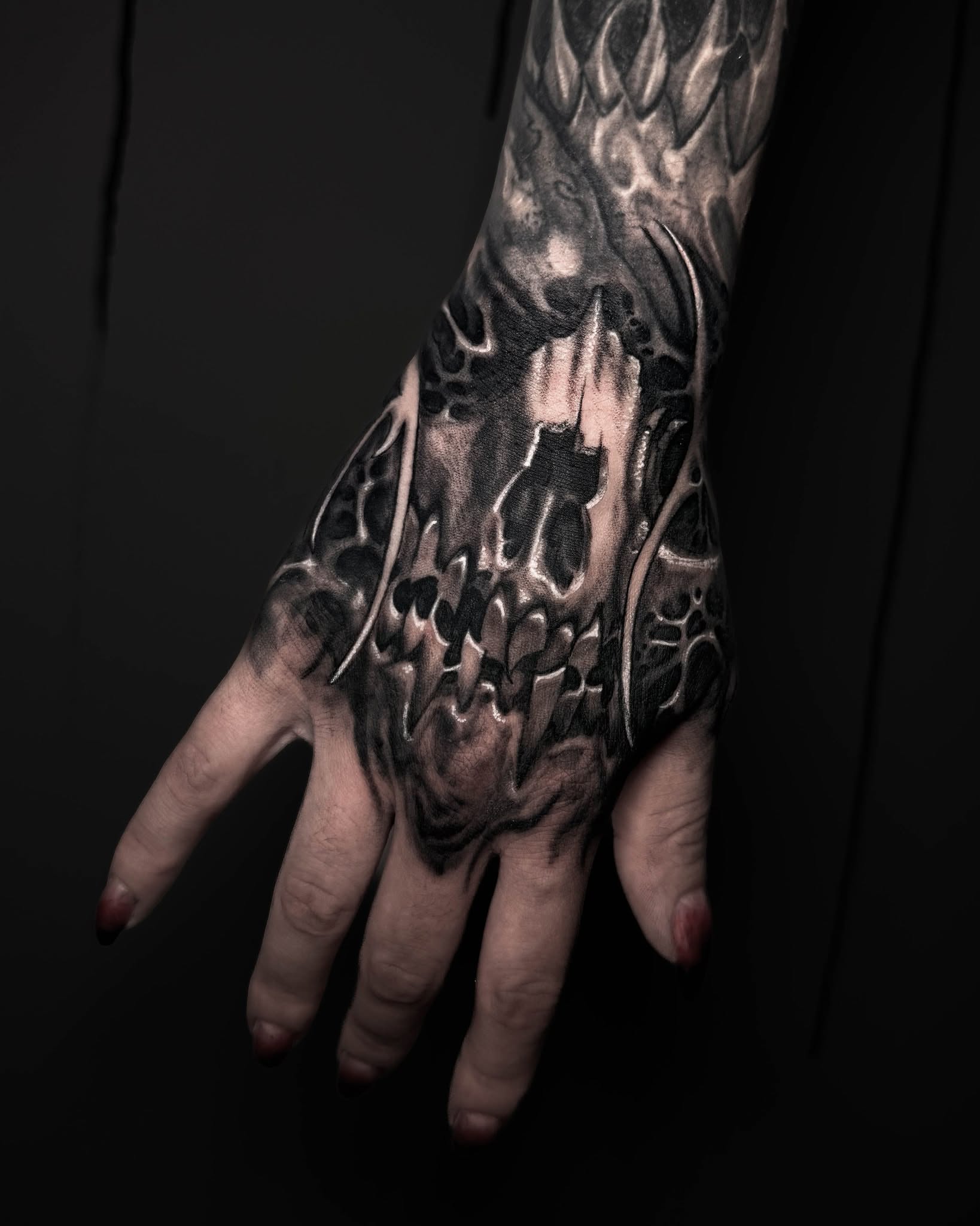 Abstract flame dark realism tattoo on the hand by Bruno Moretti