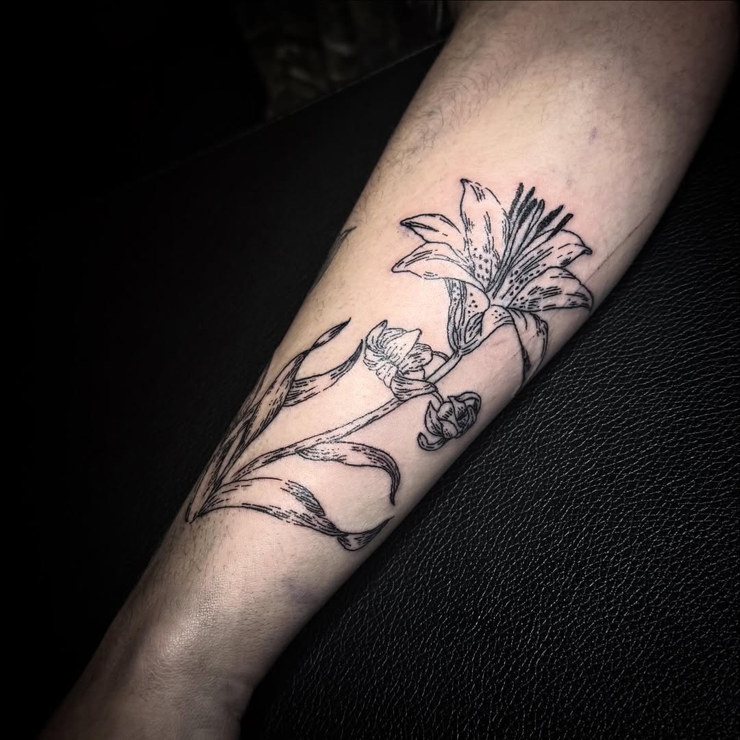 Lily flower and buds fine line tattoo on the forearm by Cullen-Lee