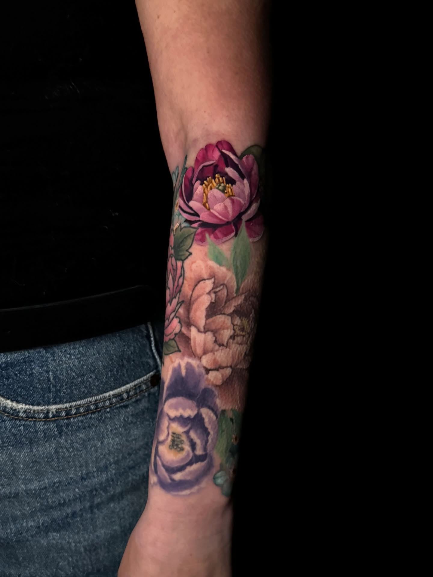 Peony flowers realism tattoo on the forearm by Brad Snow