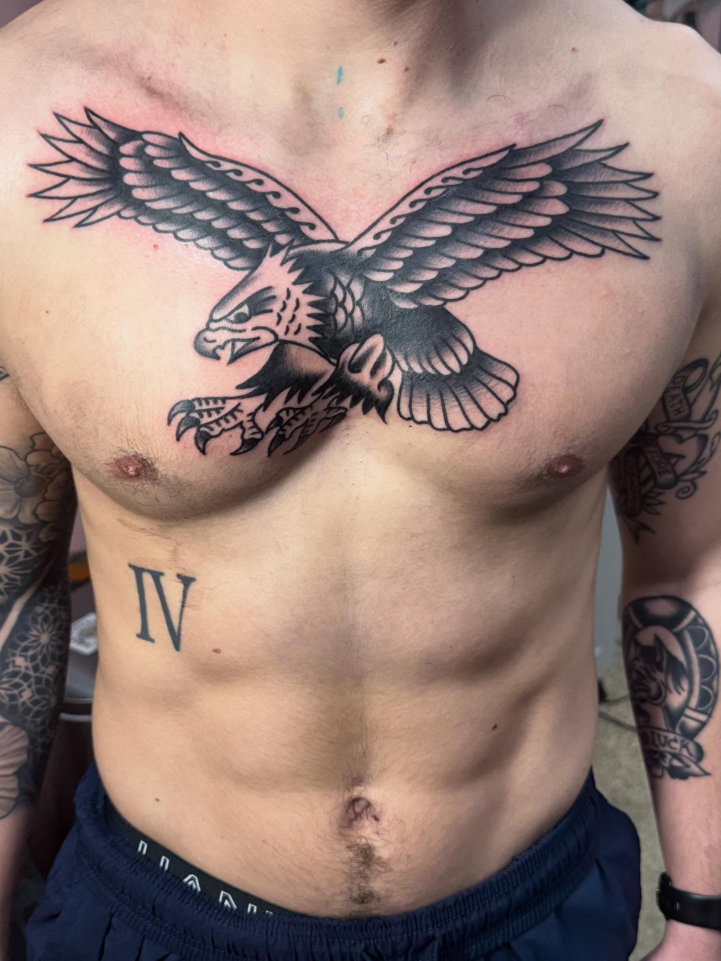 Eagle American traditional tattoo on the chest by Jesse Coldiron