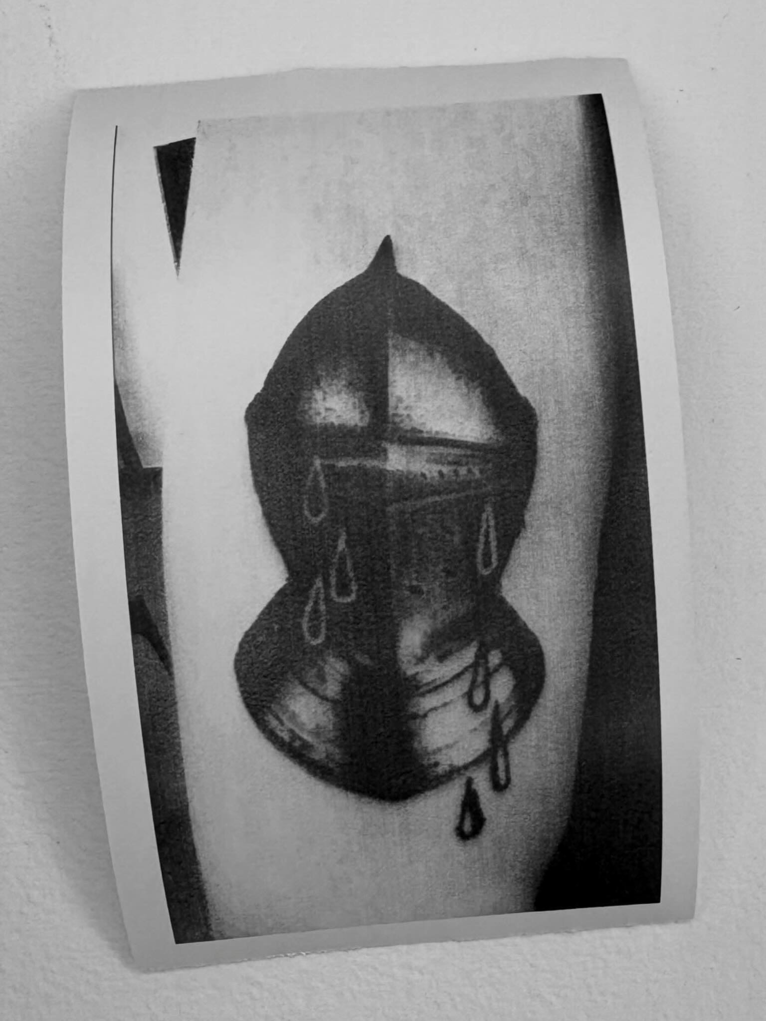 Helmet with tears black and grey tattoo on the forearm by @lil_stinker_5000, Portland, Oregon