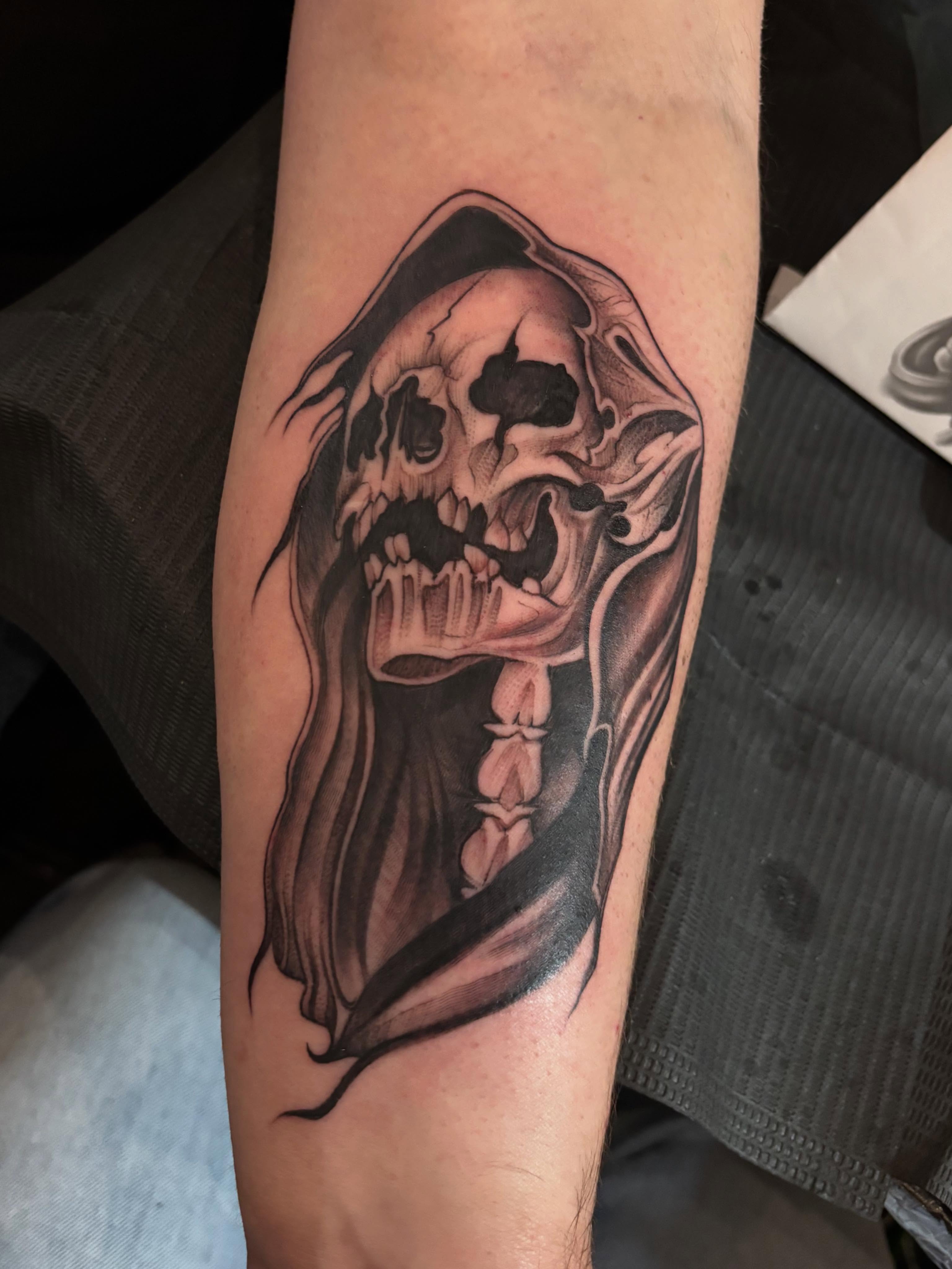 Skull realism tattoo on the forearm by Jennifer Flores