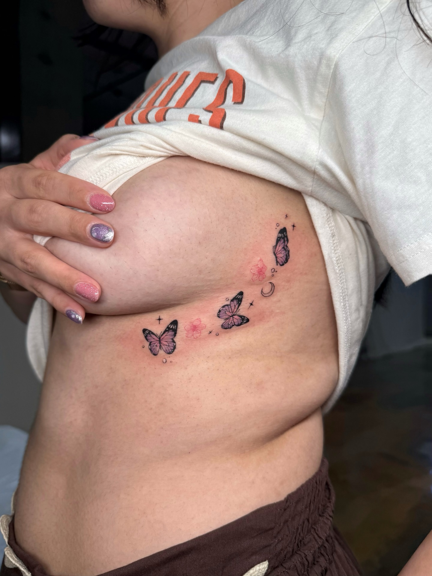 Butterflies and flowers dotwork tattoo on the ribs by ๐๐๐๐๐๐